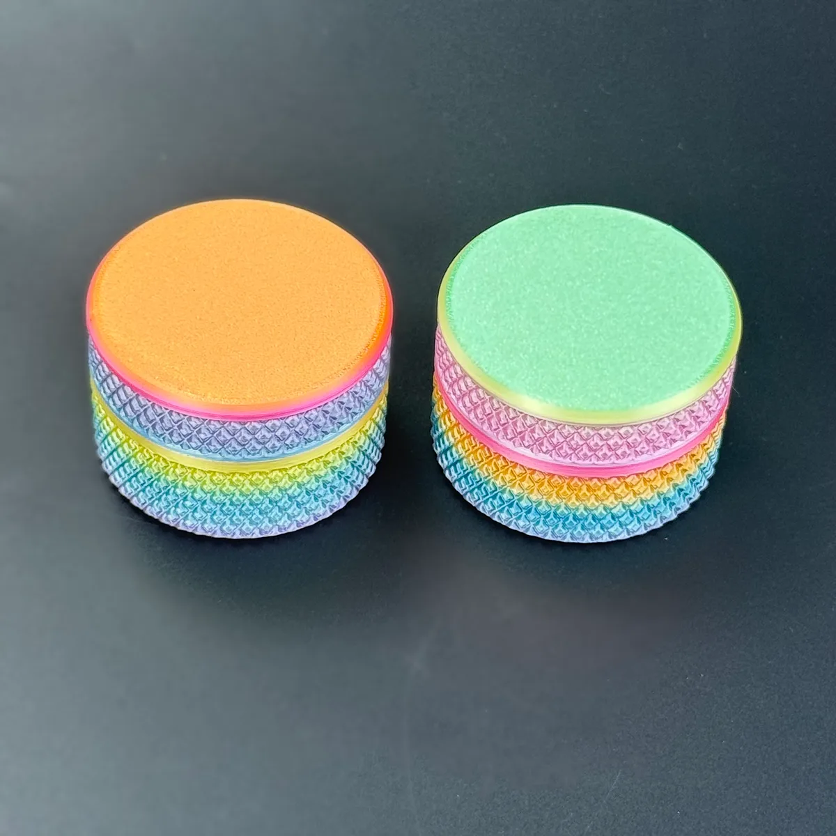 two PLA gradient cylindrical vial cases closed, side by side