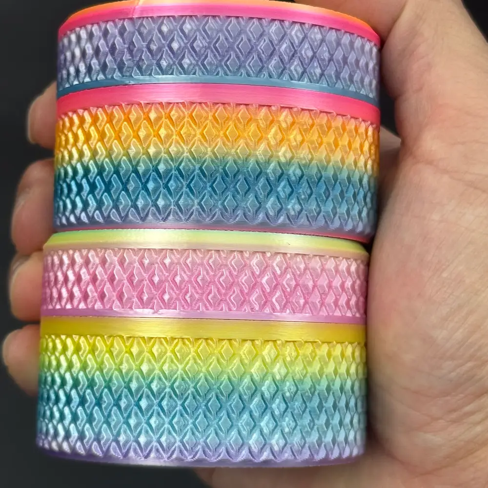 four cylindrical vial cases stacked in one palm