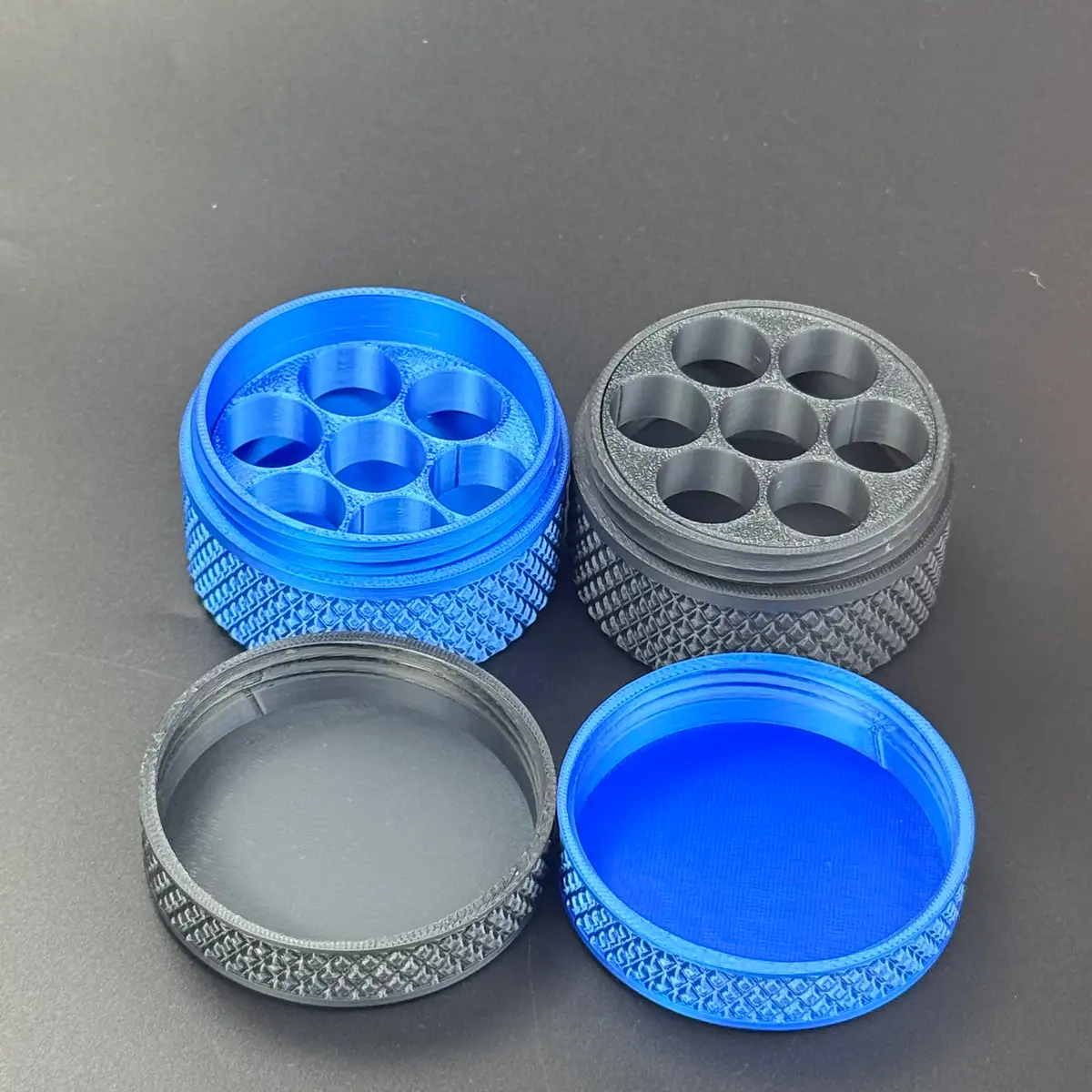 both quiet-coloured cases open, blue on blue and grey on grey