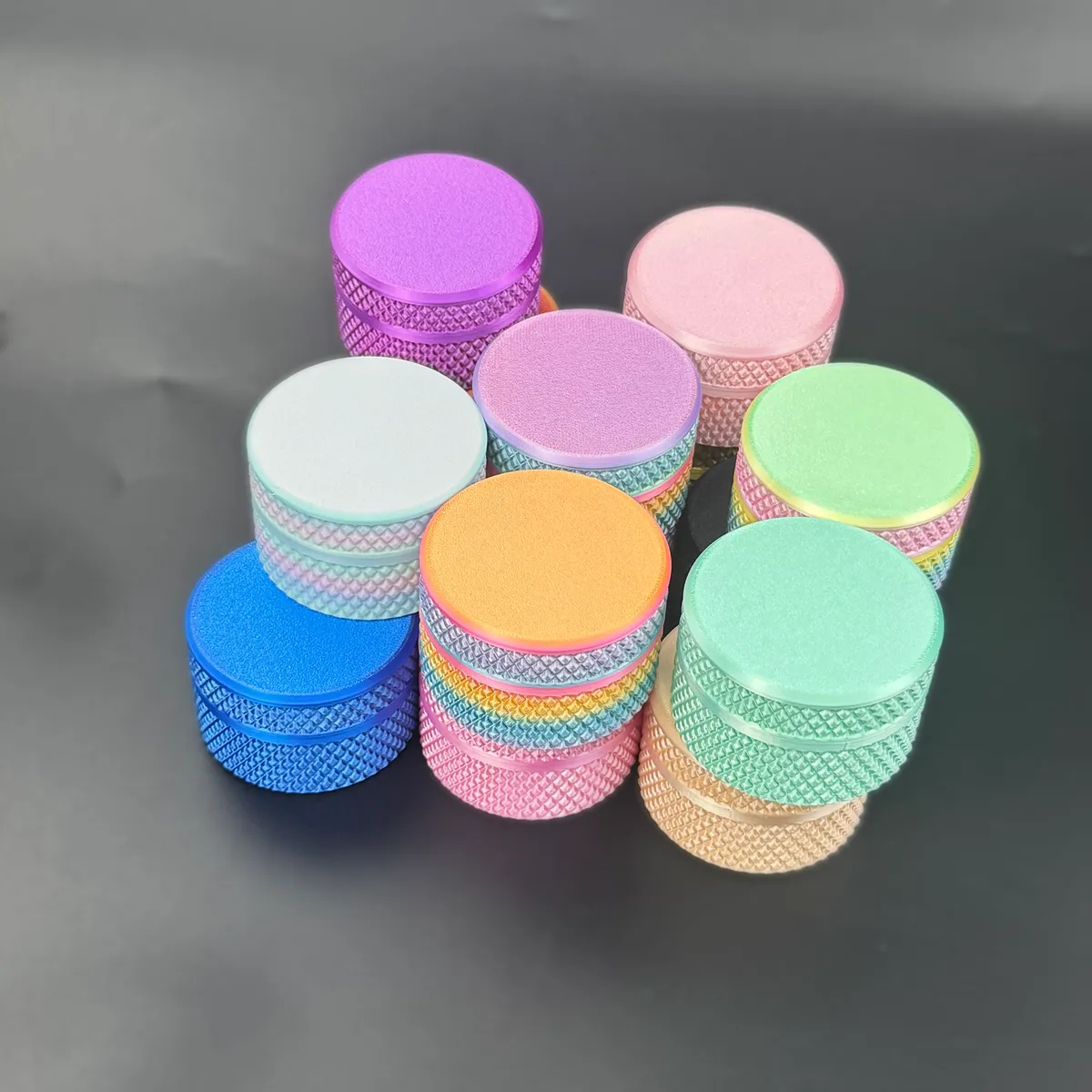 the whole colour range of cylindrical vial cases stacked together