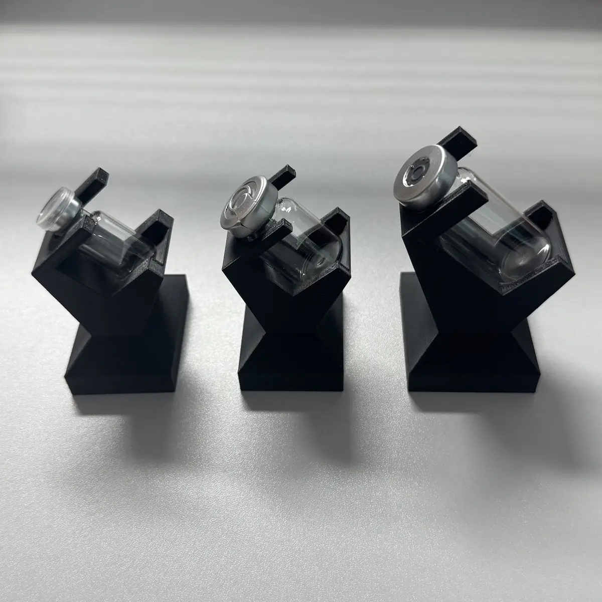 custom PETG vial display stand set with 3ml, 5ml and 10ml glass vials, three sizes at an angle