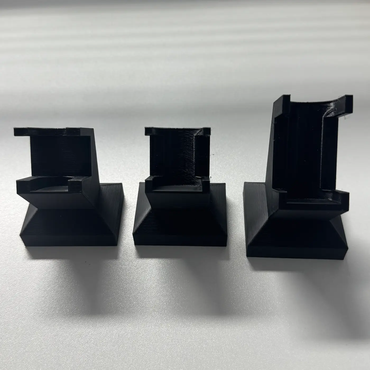 empty PETG vial stand front view showing the twin claws and V-shaped cradle