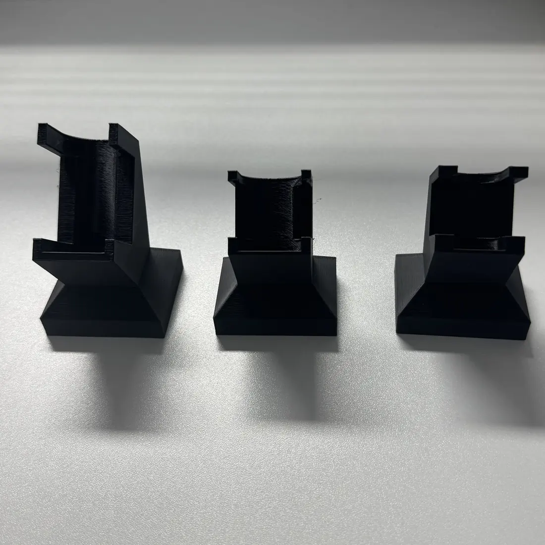 empty vial display stands seen from another angle, three sizes