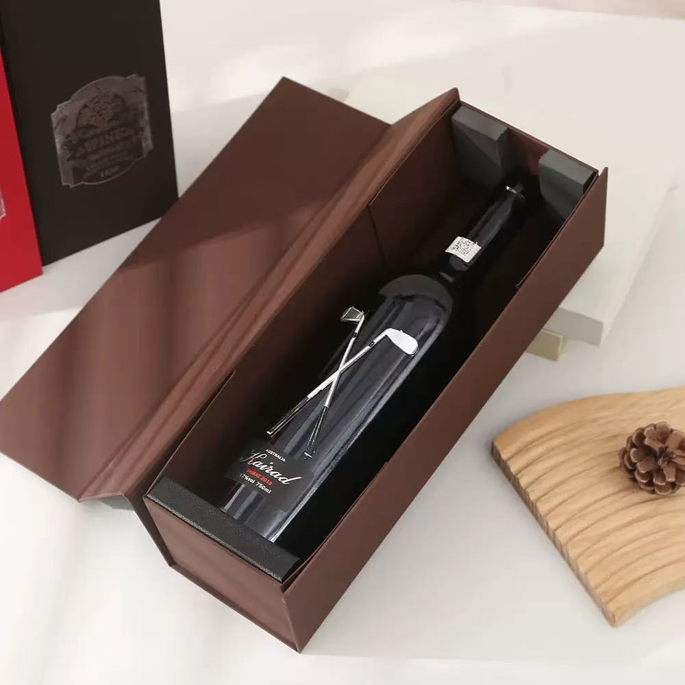 Black foldable wine gift box with lid, open to show red wine bottle inside, elegant packaging for gifting or storage