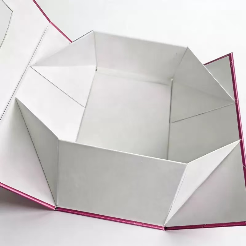 White cardboard box with red edges, open and folded — ideal for paper towel or toilet paper storage