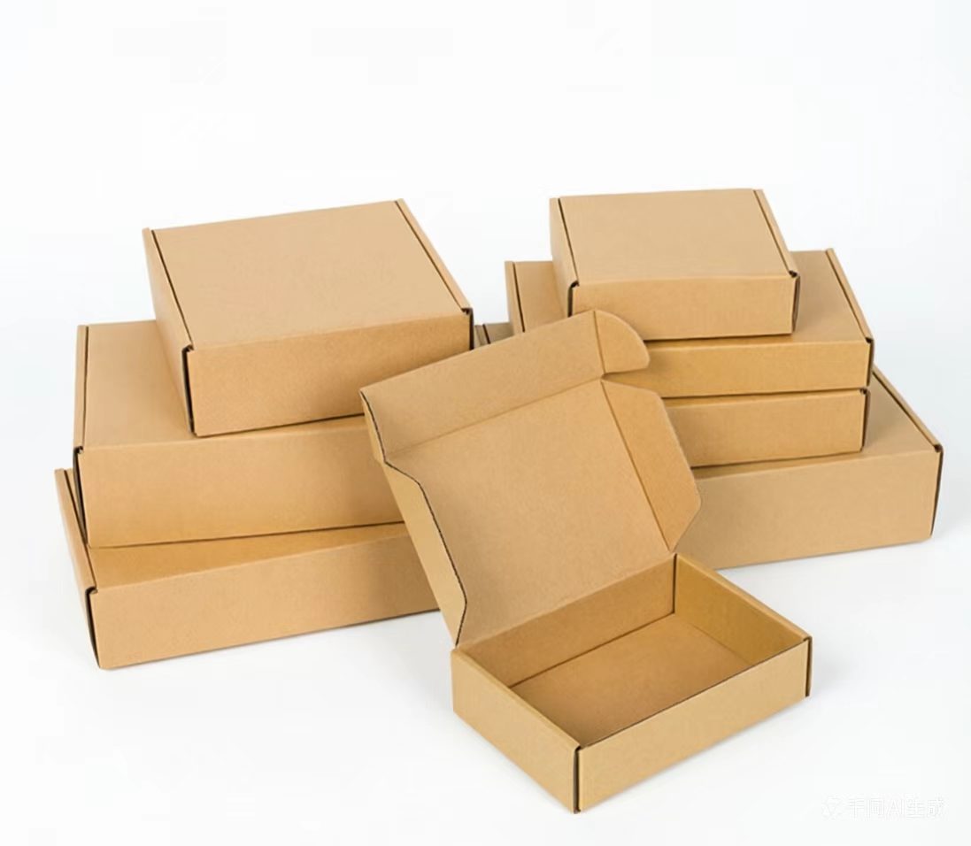Wholesale kraft paper boxes and kraft paper gift boxes displayed in stack arrangement, one open box in foreground showing interior structure — eco-friendly, customizable packaging solutions by Fuyang Packaging.