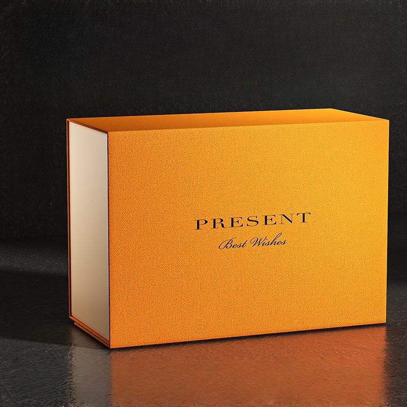 Vibrant orange HC.PRINTERS gift box with gold