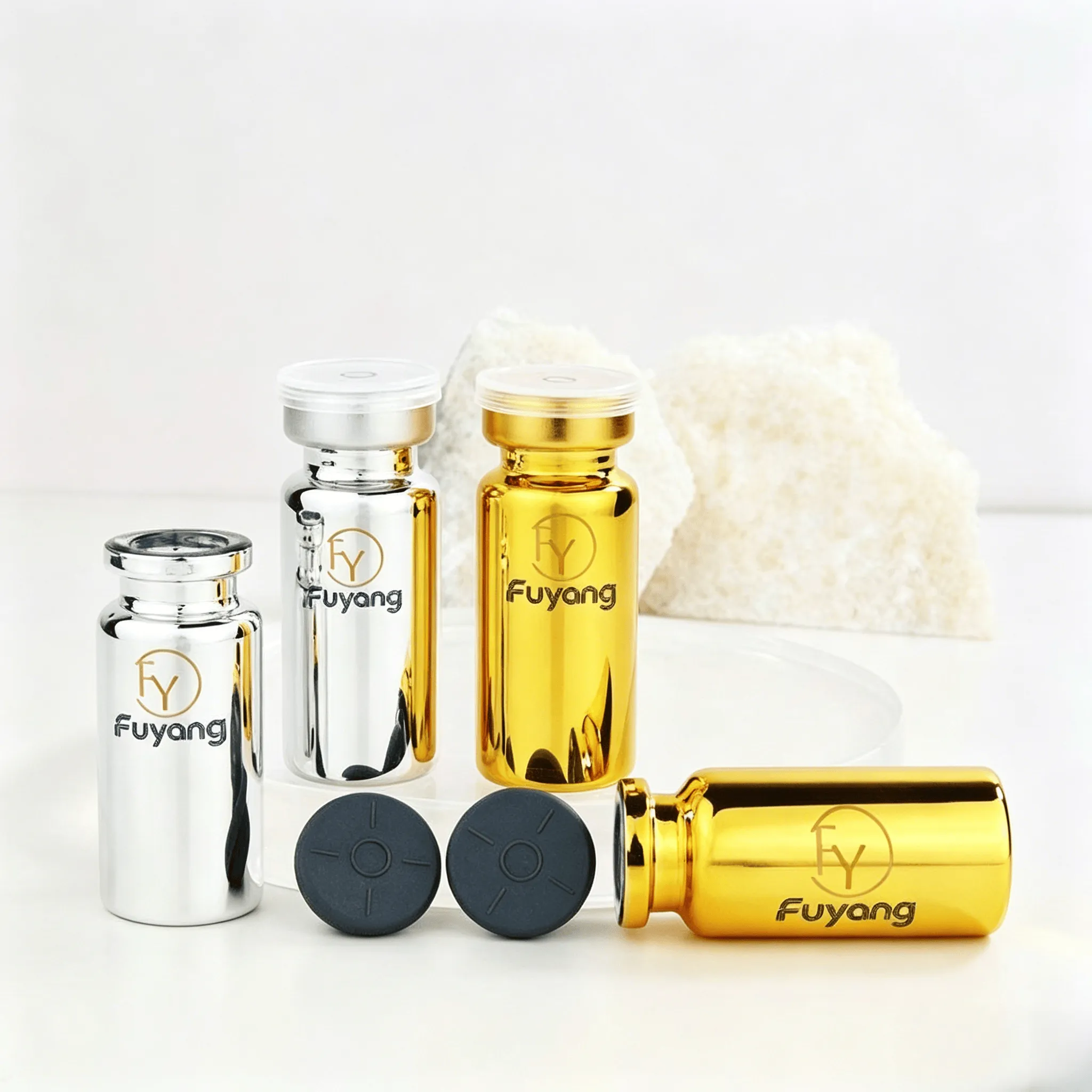 Electroplated vials in silver and gold, made of borosilicate glass, with airtight butyl rubber stoppers and aluminum caps, suitable for laboratory samples and cosmetics.