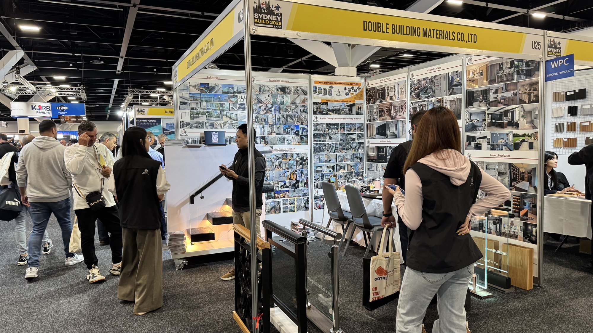 Double Building booth U25 at Sydney Build 2026 with a yellow header, project walls and railing samples