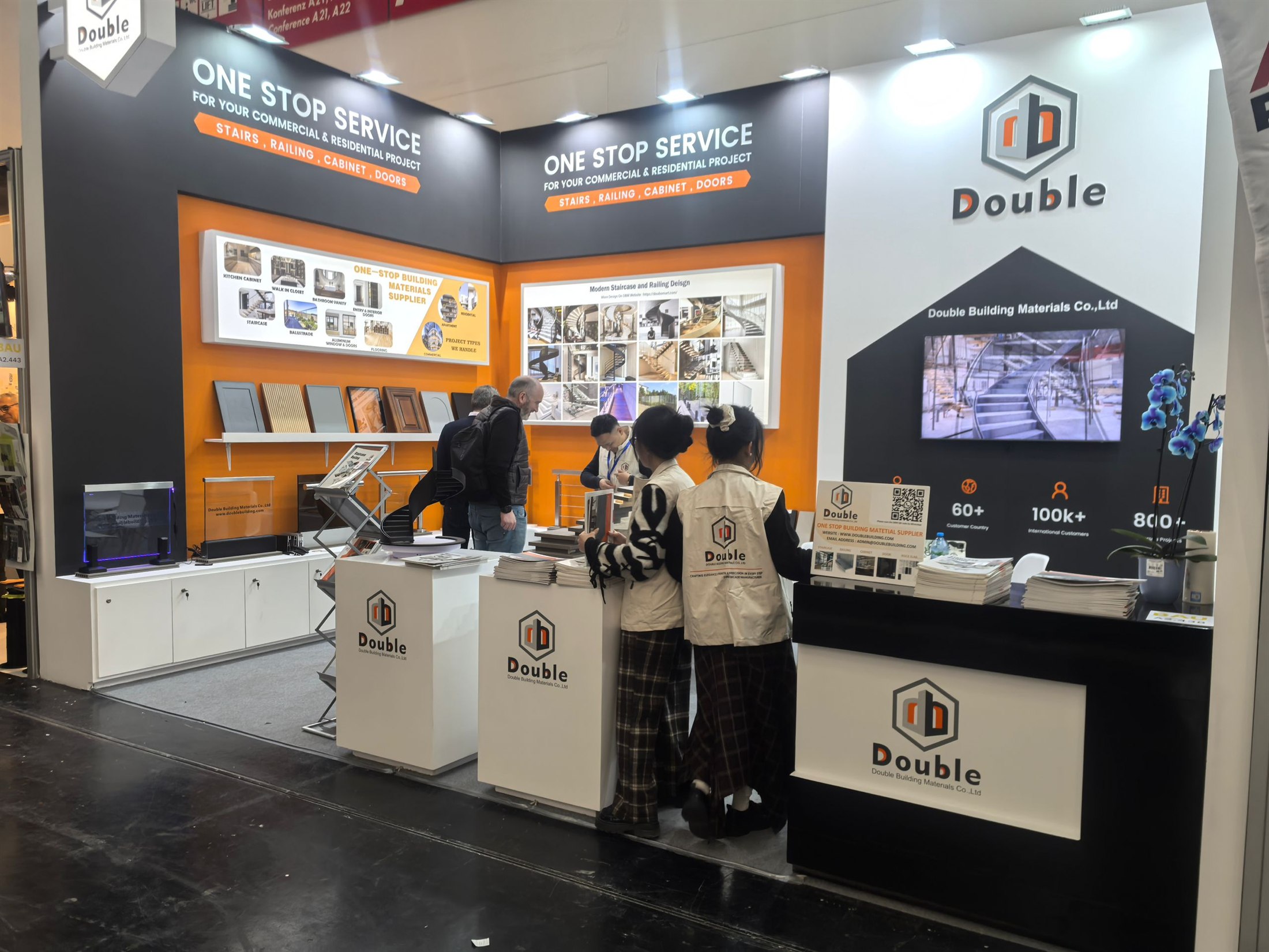 Eye-level view of the Double Building booth at BAU 2025 with catalogues on the front counters