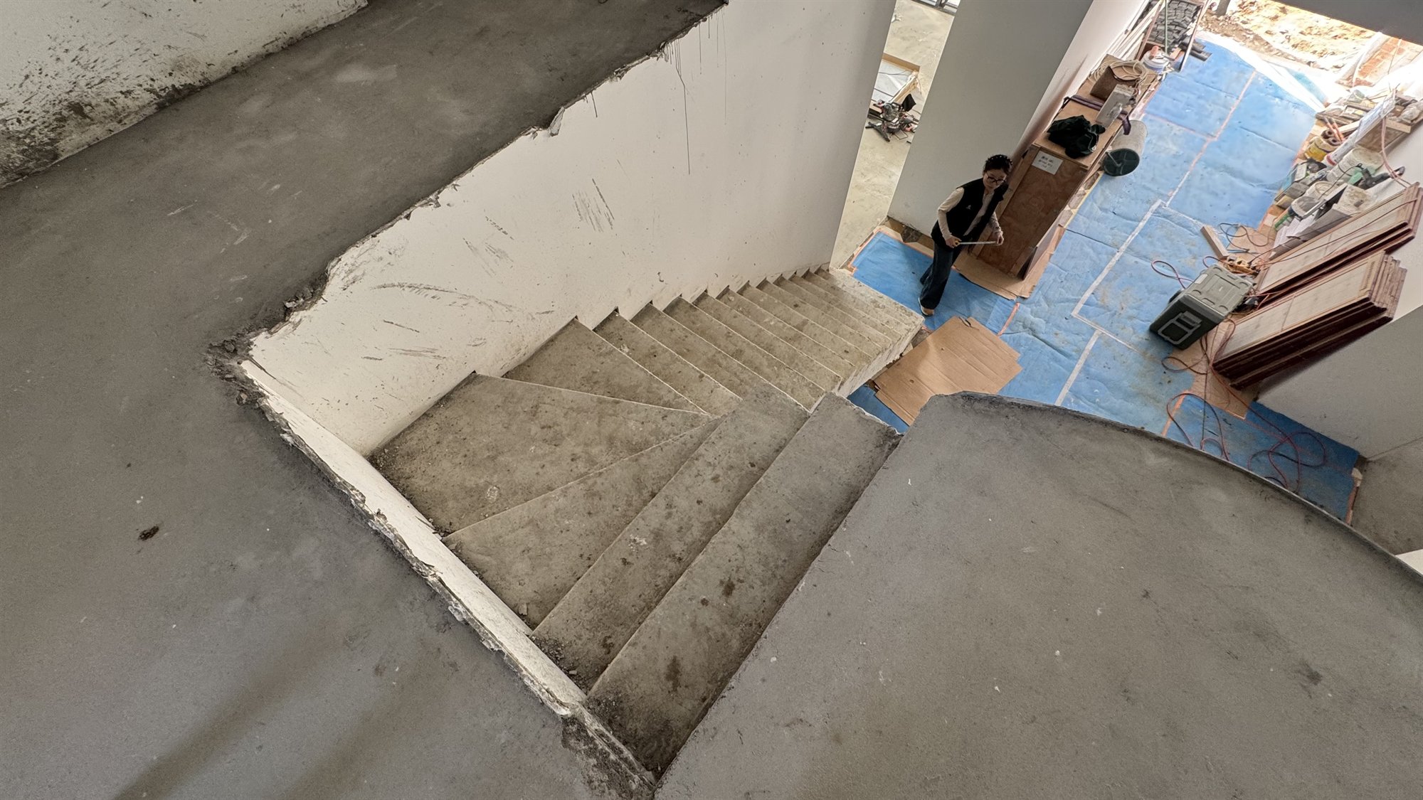 Unfinished concrete winder staircase seen from above in a Sydney home under construction