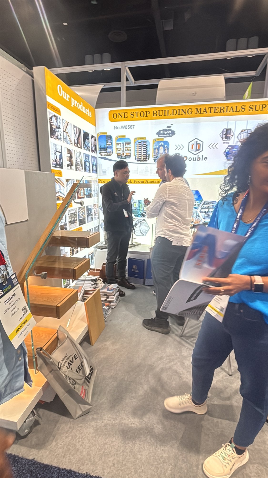 Visitor reading a catalogue at the IBS 2026 booth