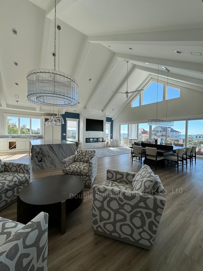 Virginia great room with light wood floors and open plan near the square tube stair