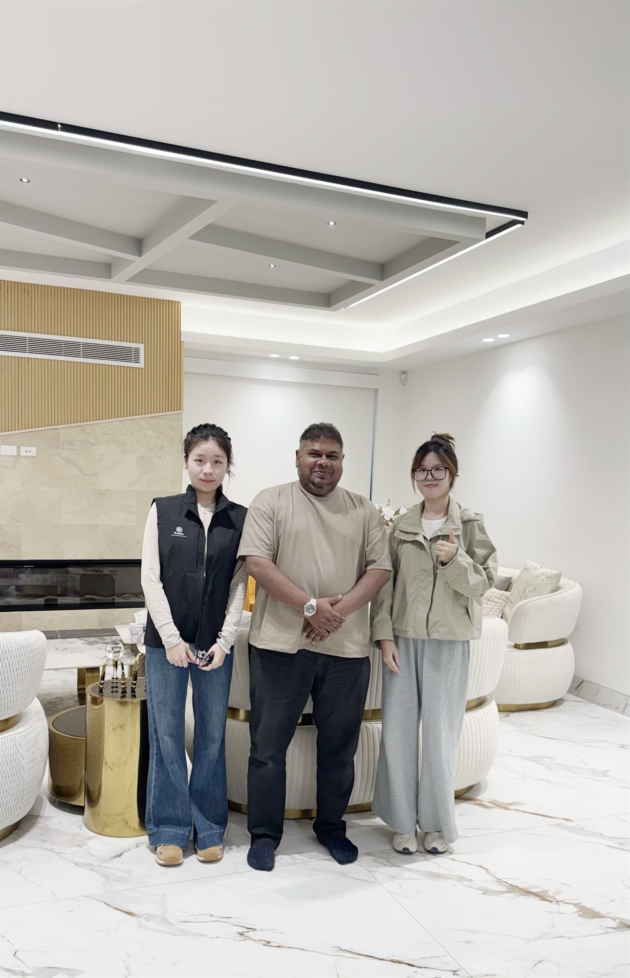 Staff standing with a contact in a finished Sydney living room
