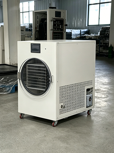 Geliss home freeze dryer side perspective view real shot on the production floor, highlighting the large square ventilation cooling grid and the integrated built-in vacuum pump compartment at the base of the white cabinet