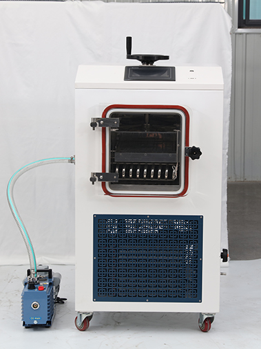 Front view real shot of a cabinet vacuum freeze dryer lyophilizer machine, showing its clear chamber door, bottom ventilation grille, and external pump.
