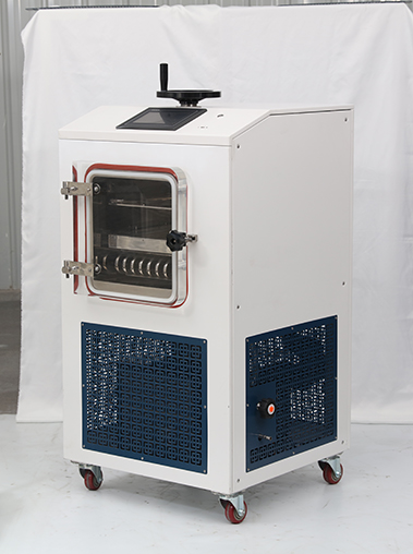 Side angle real shot of a compact laboratory freeze dryer unit, highlighting its white steel casing, side cooling vents, and top control interface.