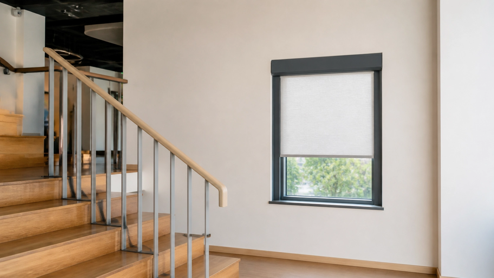 Completed WR85 indoor guided roller blind installation in a stairwell