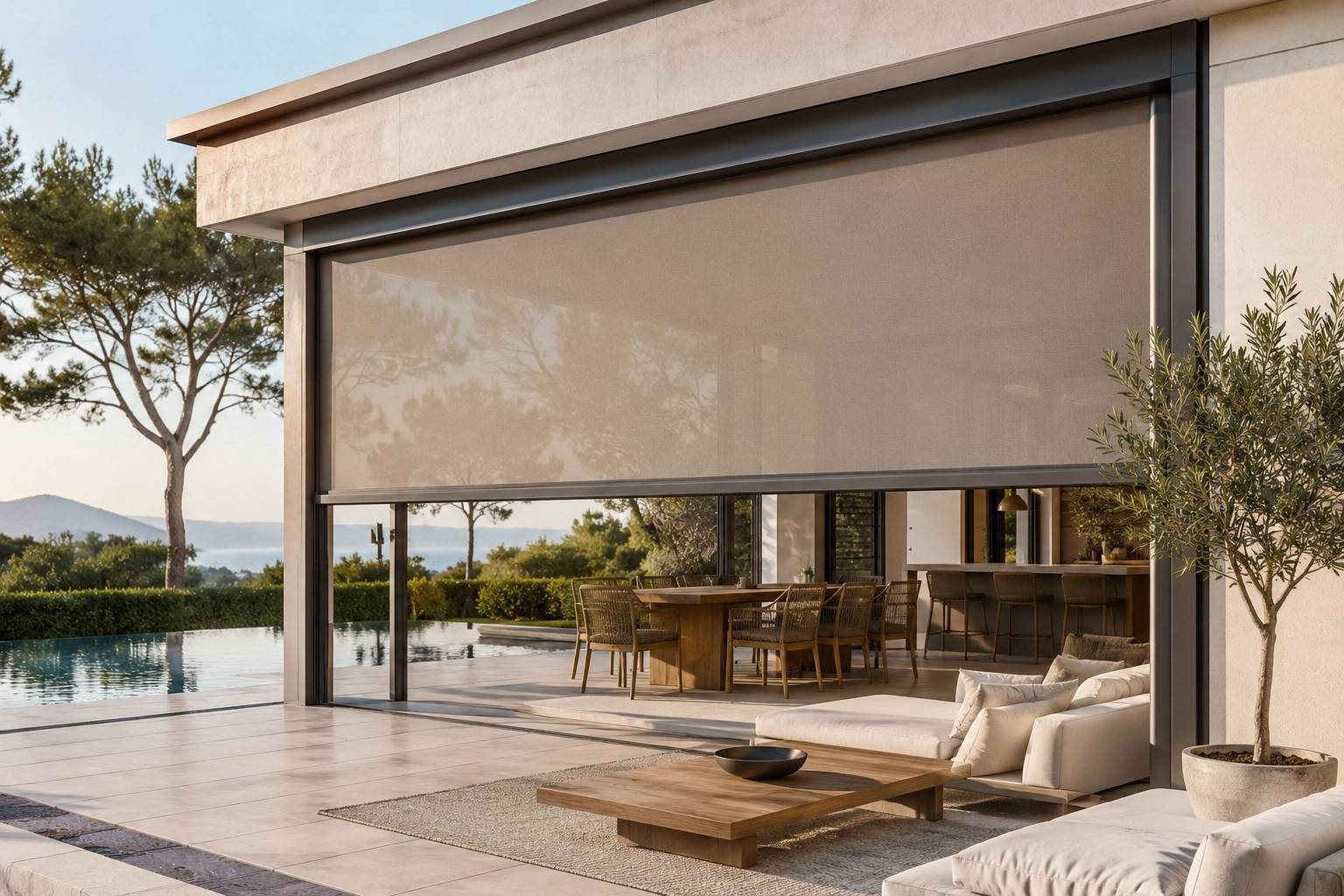 Extra-wide outdoor roller blind installed on a modern patio with pool
