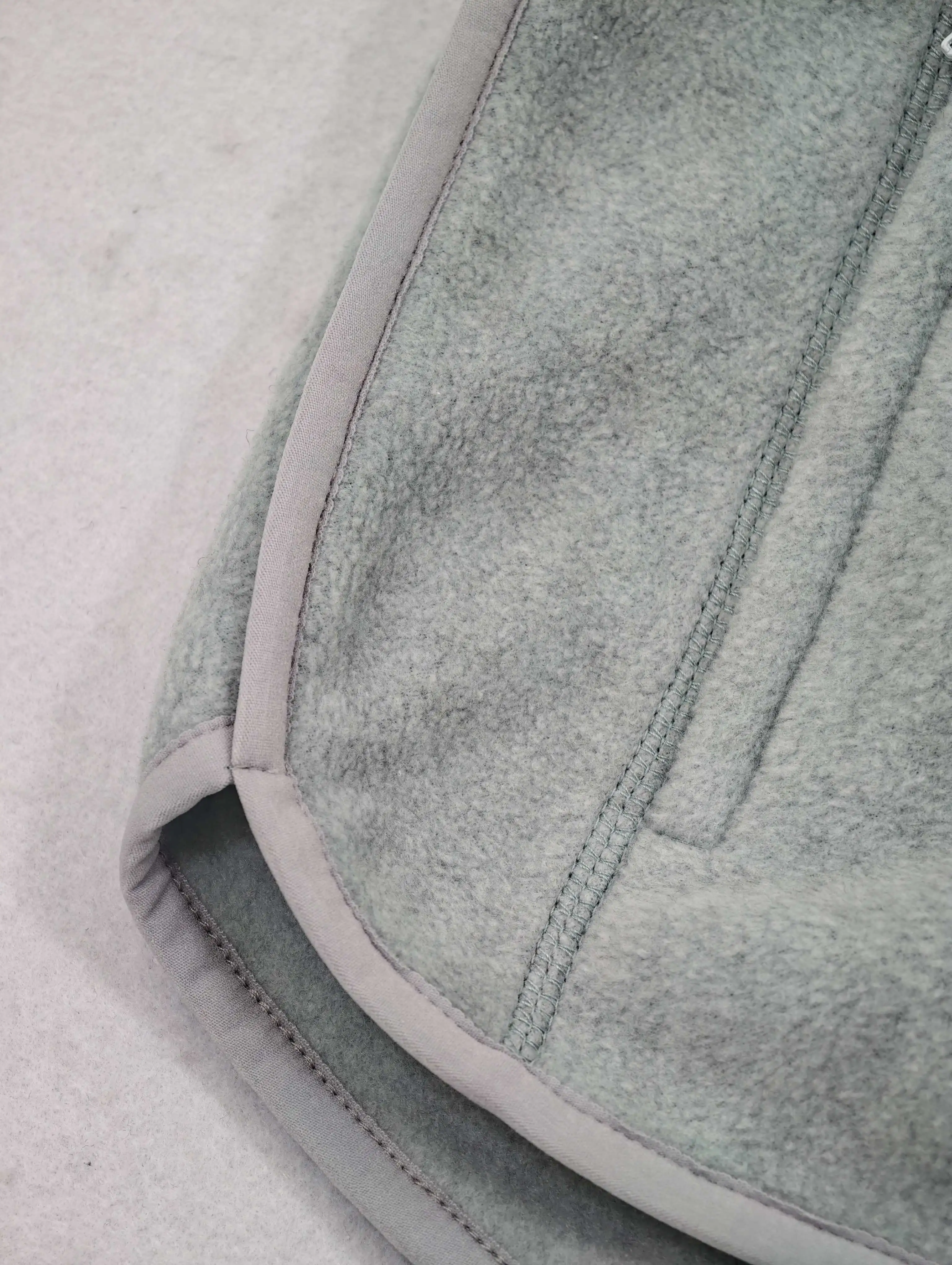 Curved dolphin hem with contrast edge binding