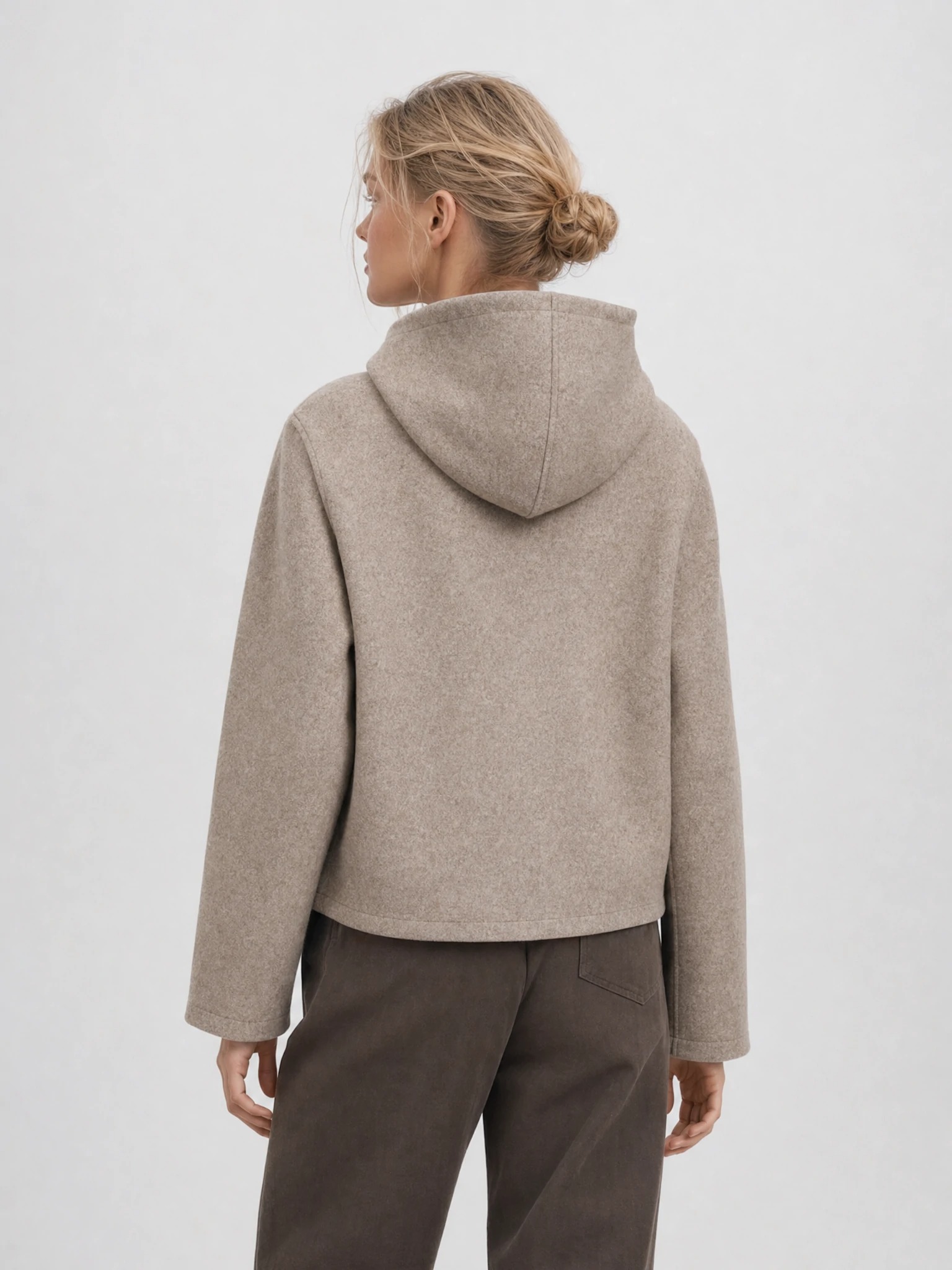 Back view of cropped hooded jacket with clean seams