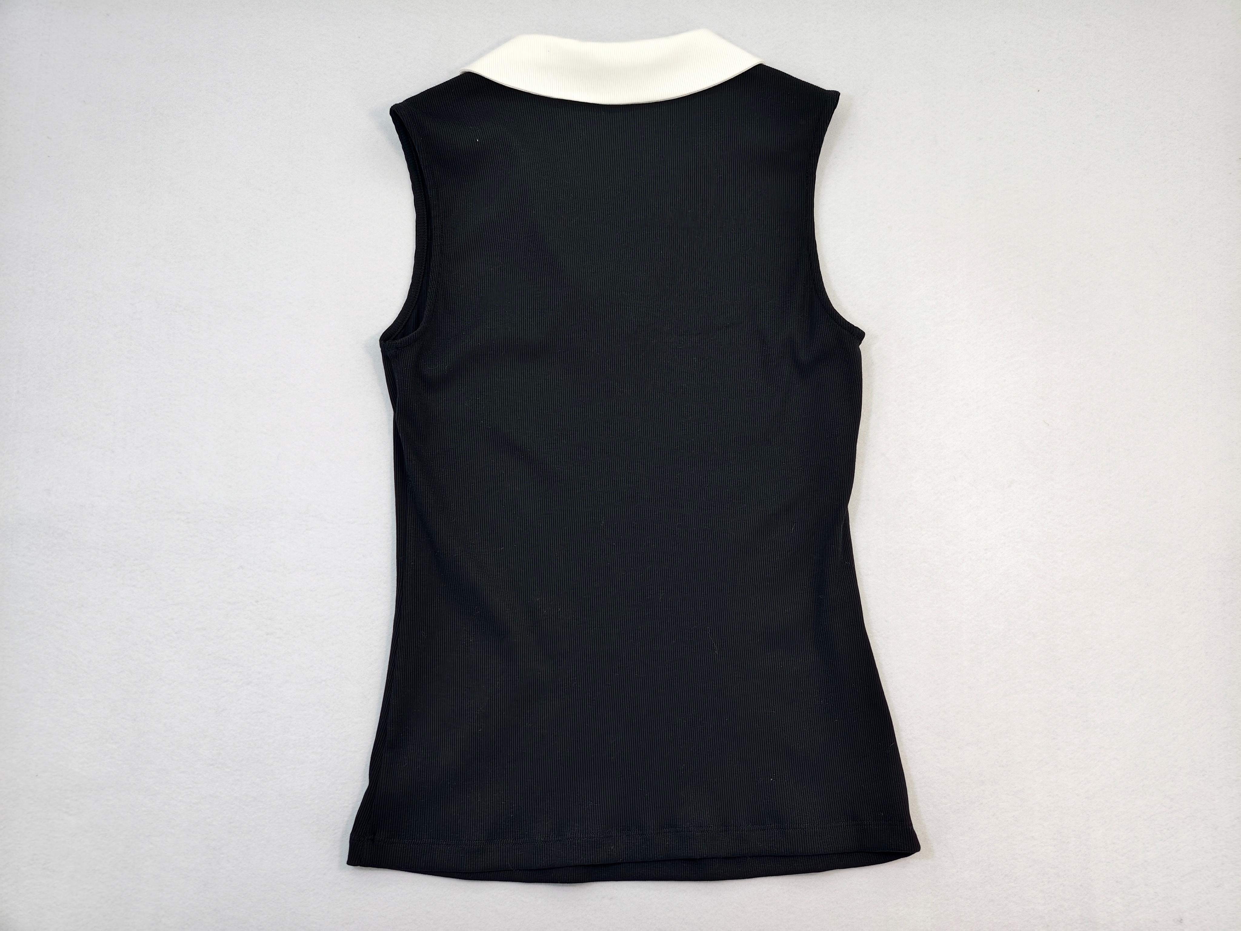 Back view of fitted black sleeveless polo top