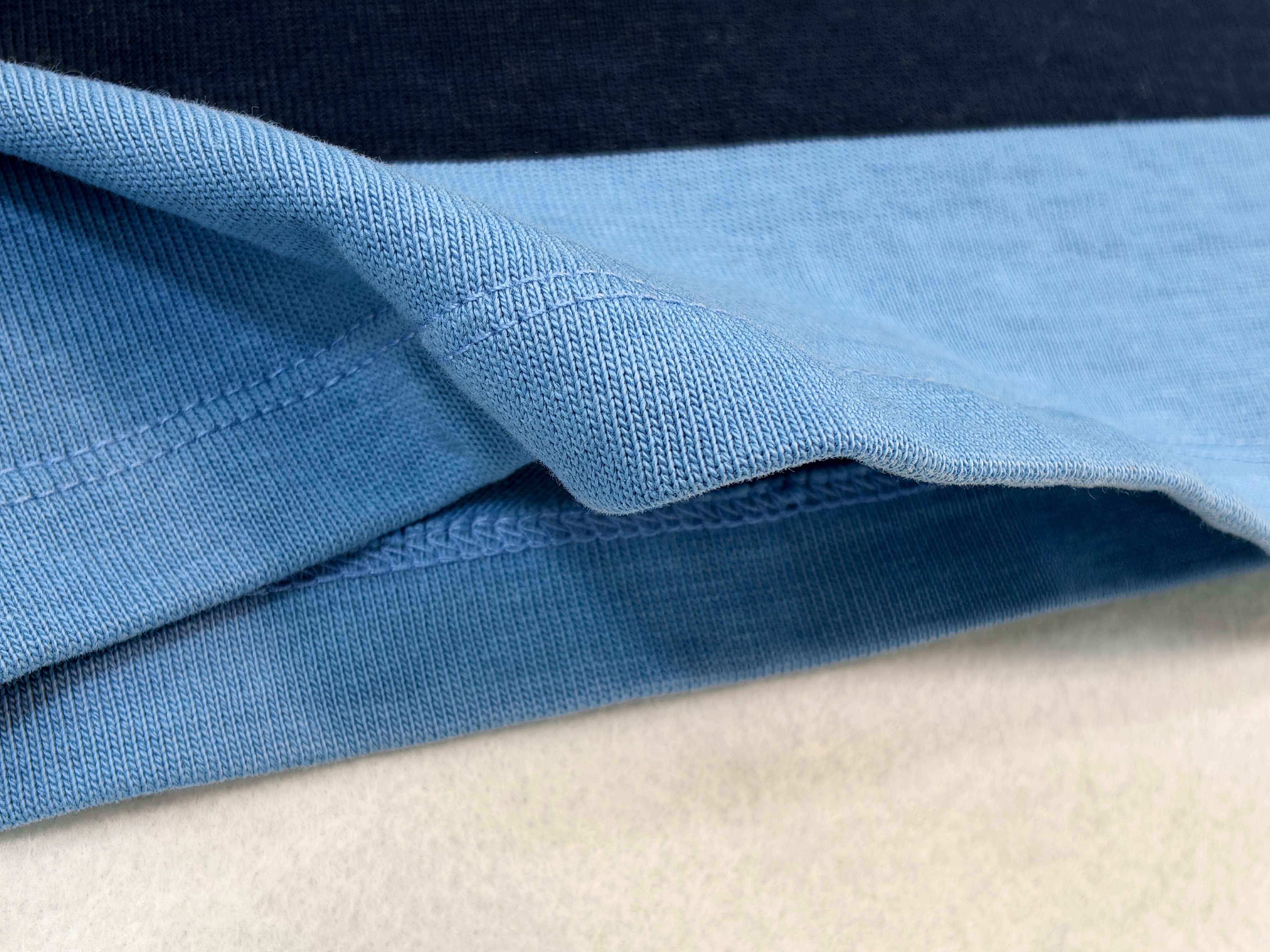 Heavy cotton knit texture and layered hem detail