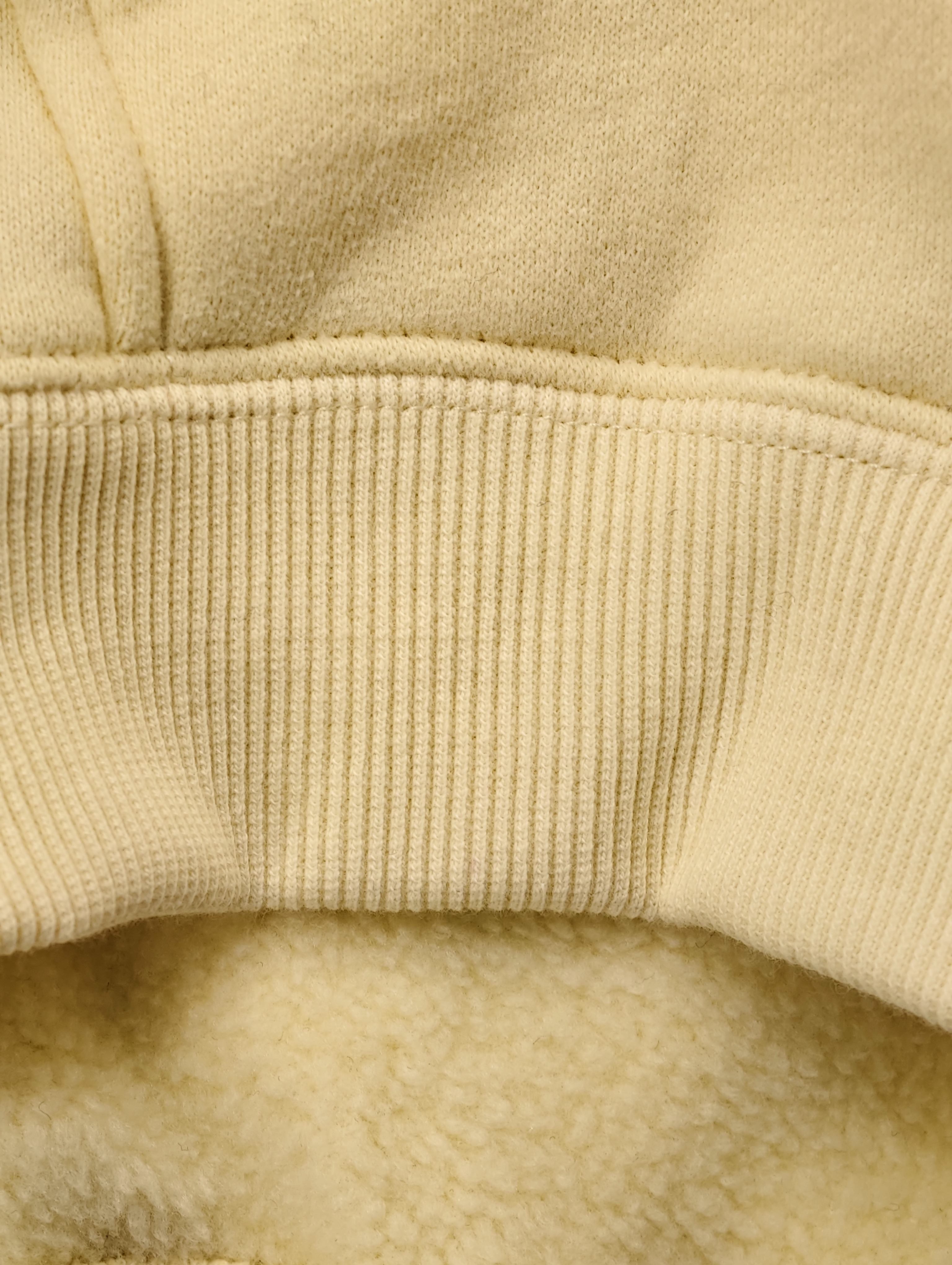 Ribbed cuff and soft brushed fleece interior detail