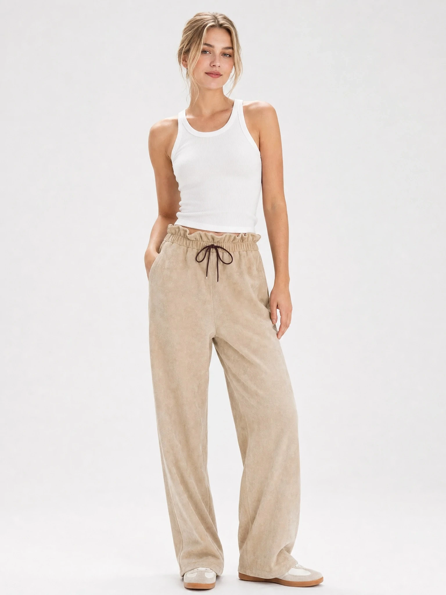 Women wearing beige paperbag-waist wide-leg pants
