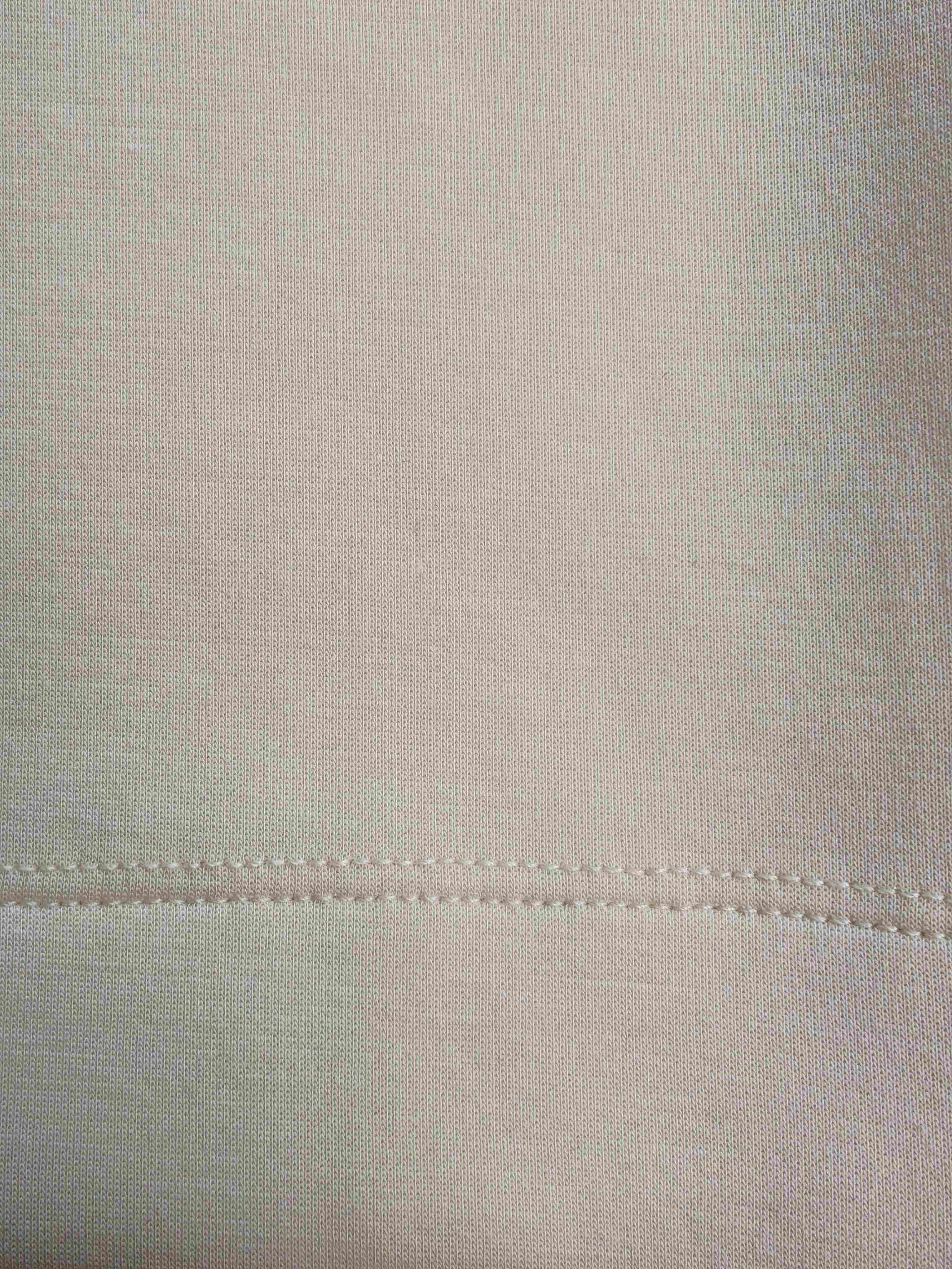 Rayon blend fabric texture and hem stitching close-up