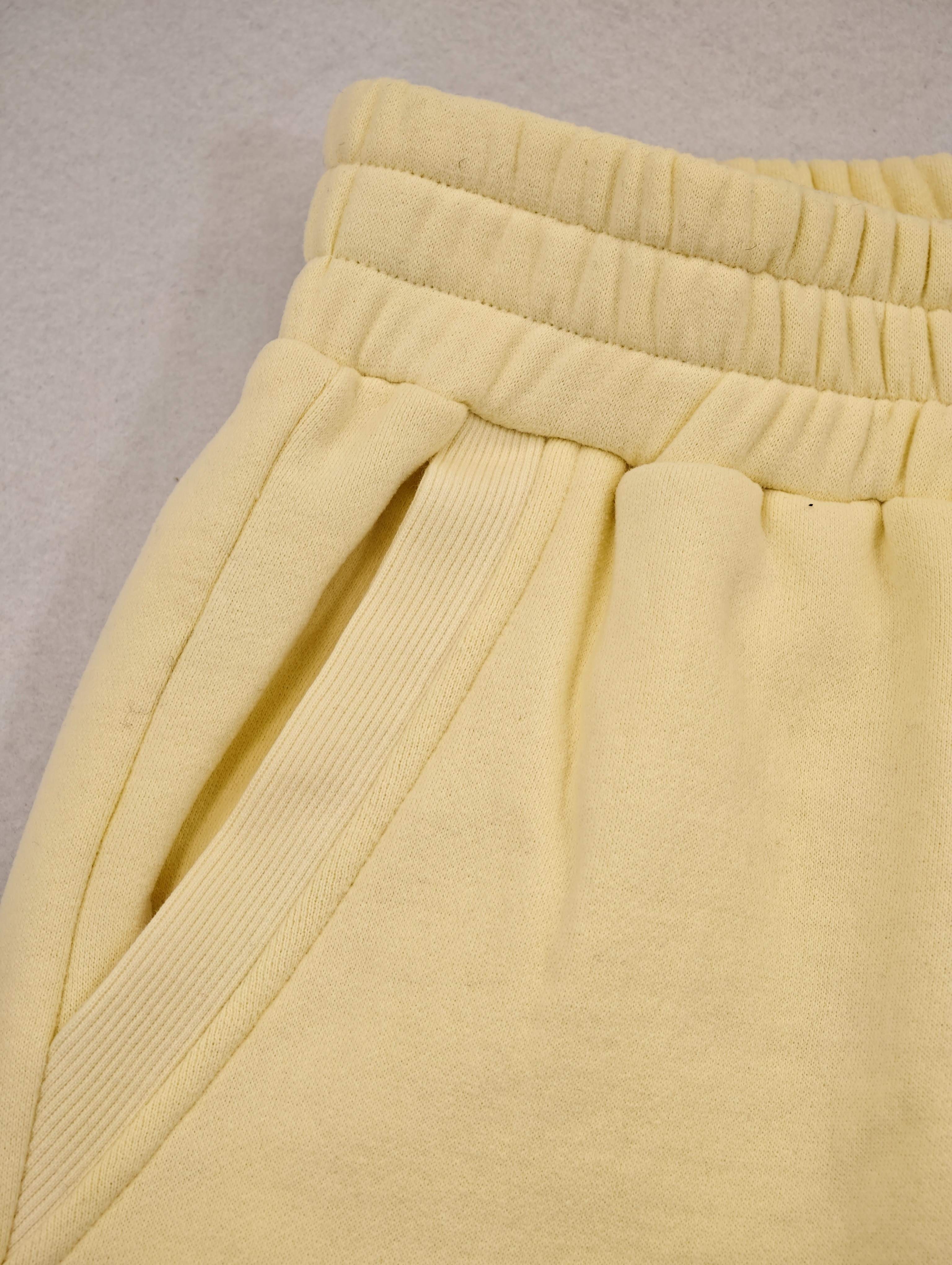 Elastic waistband and angled pocket construction detail