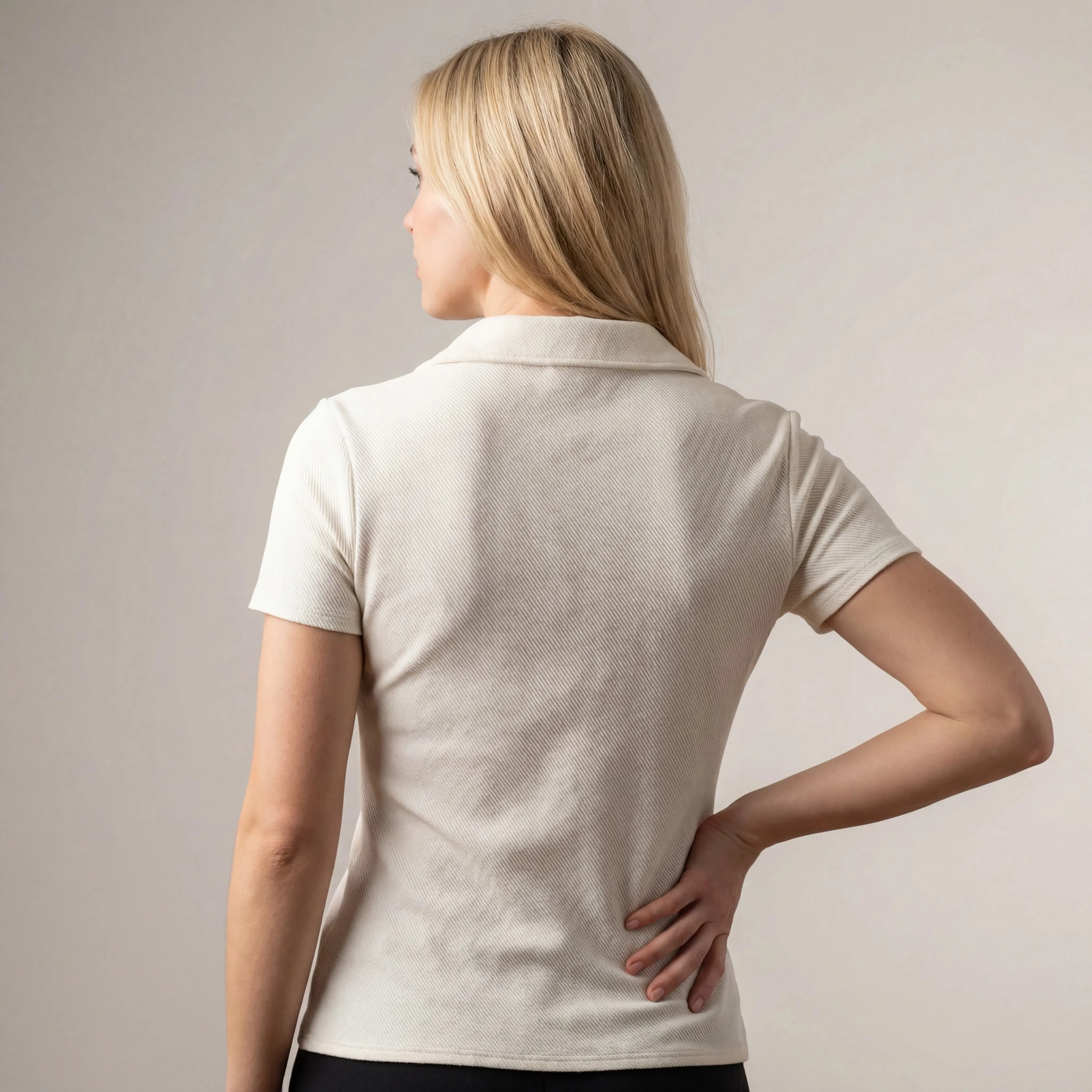 Back view showing fitted shape and short sleeves