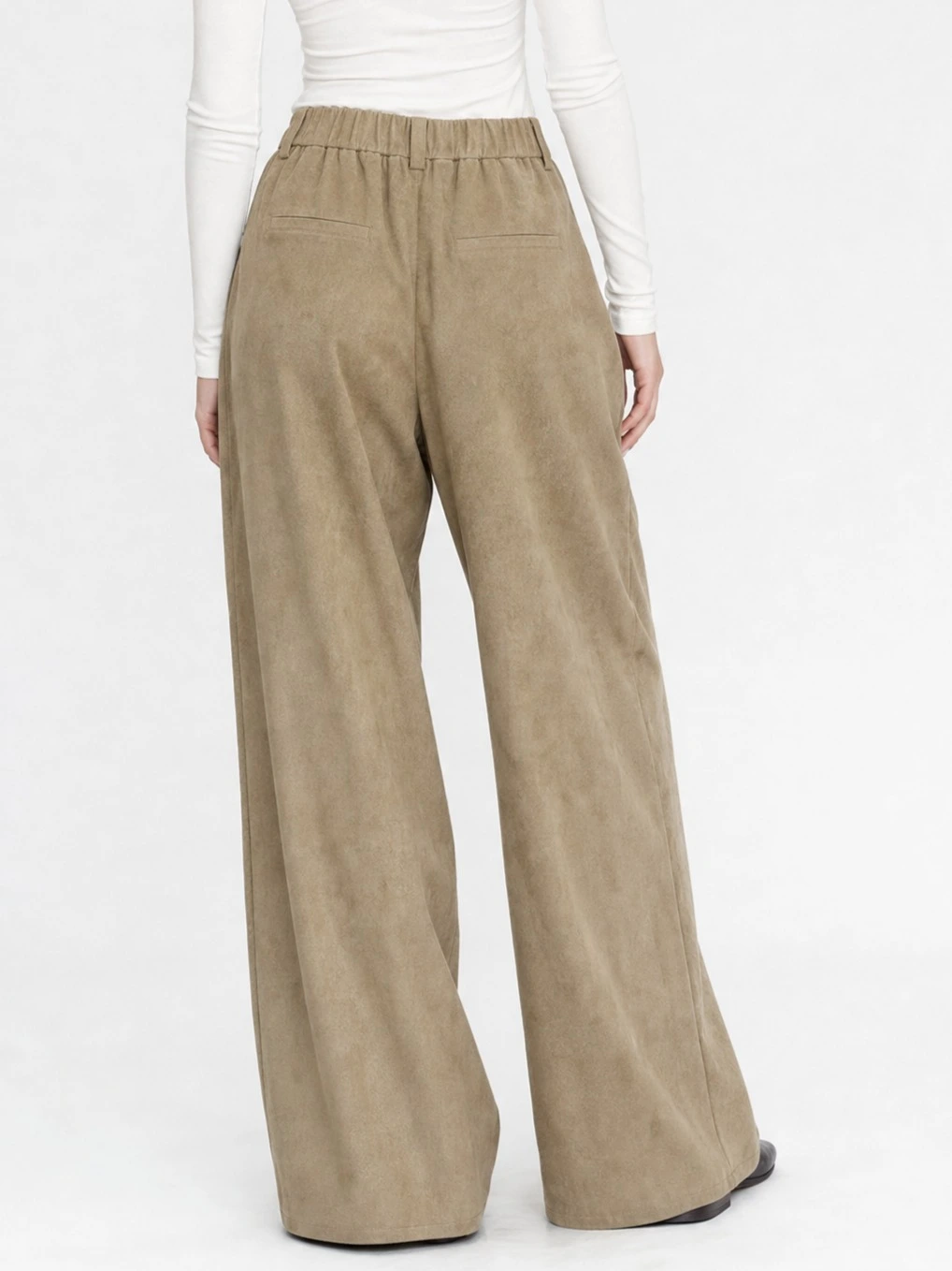 Back view of relaxed wide-leg trousers with clean drape