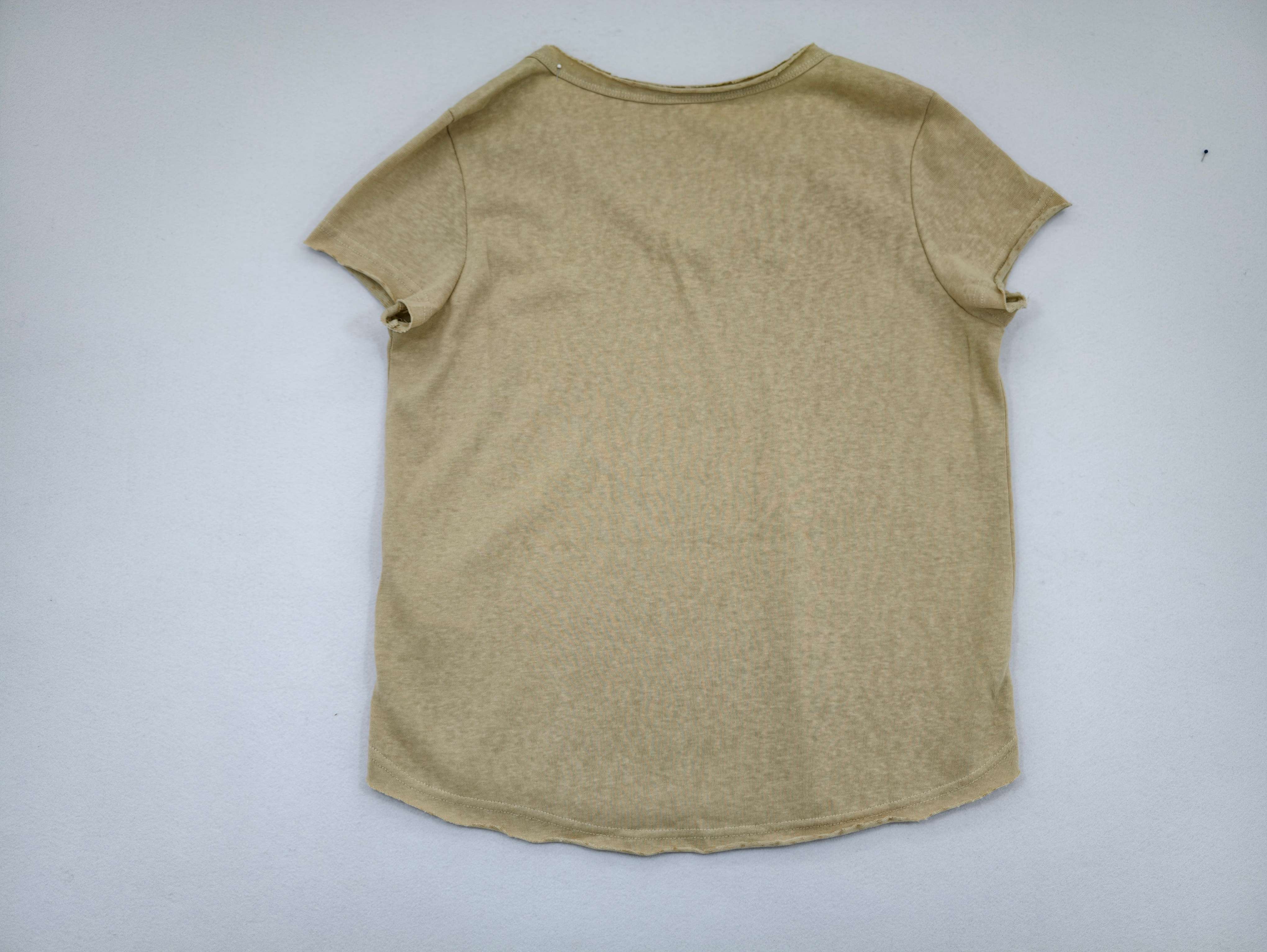 Back panel reveals relaxed shape and gently curved hem