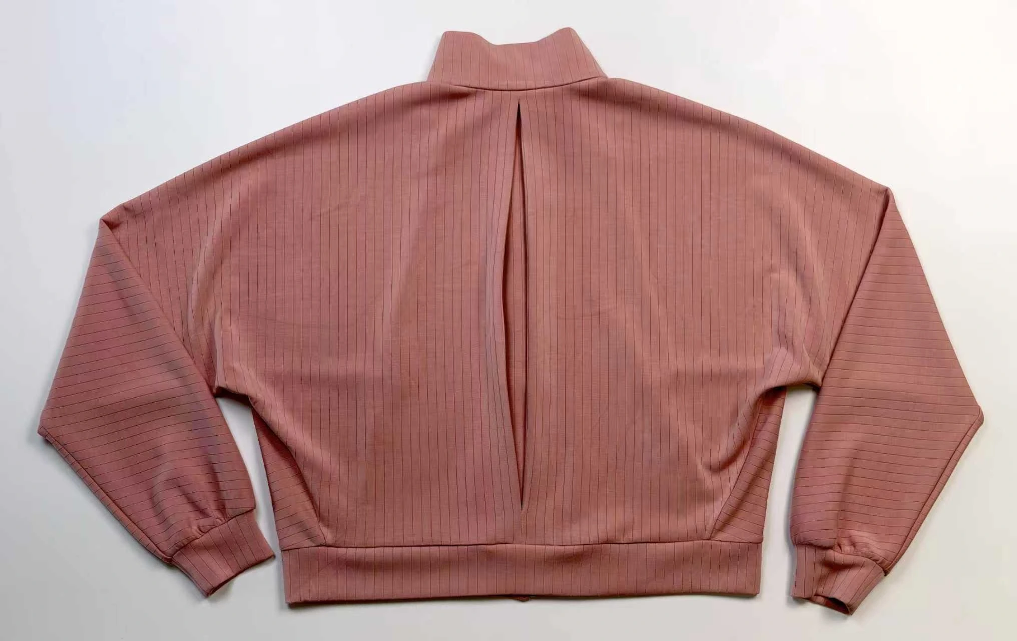 Back pleat construction adds movement to relaxed fit