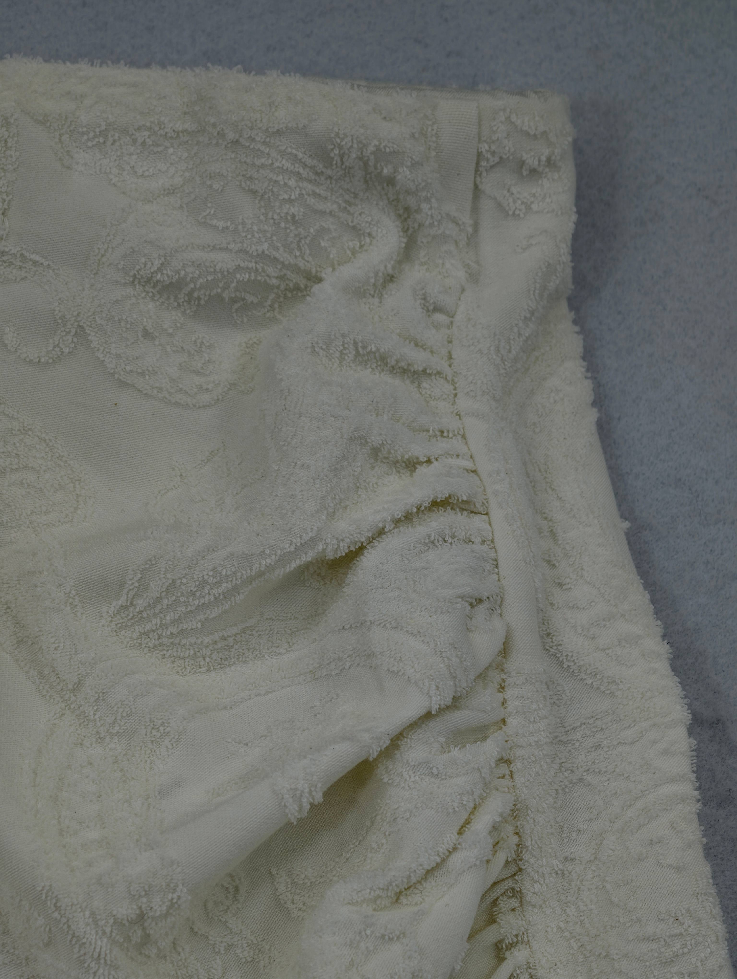 Ruched side seam and waistband construction close-up