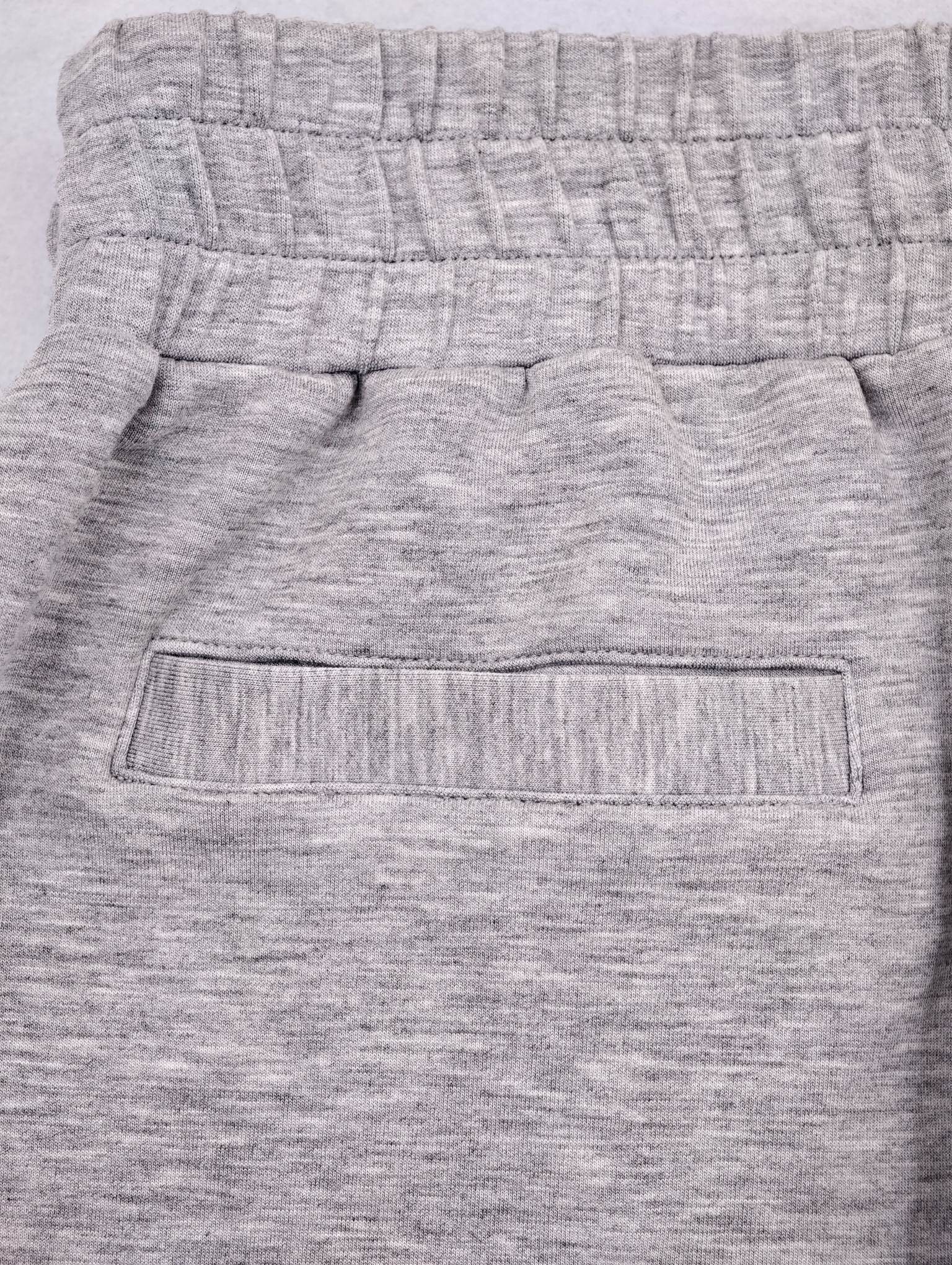 Elastic waistband and rear welt pocket construction detail
