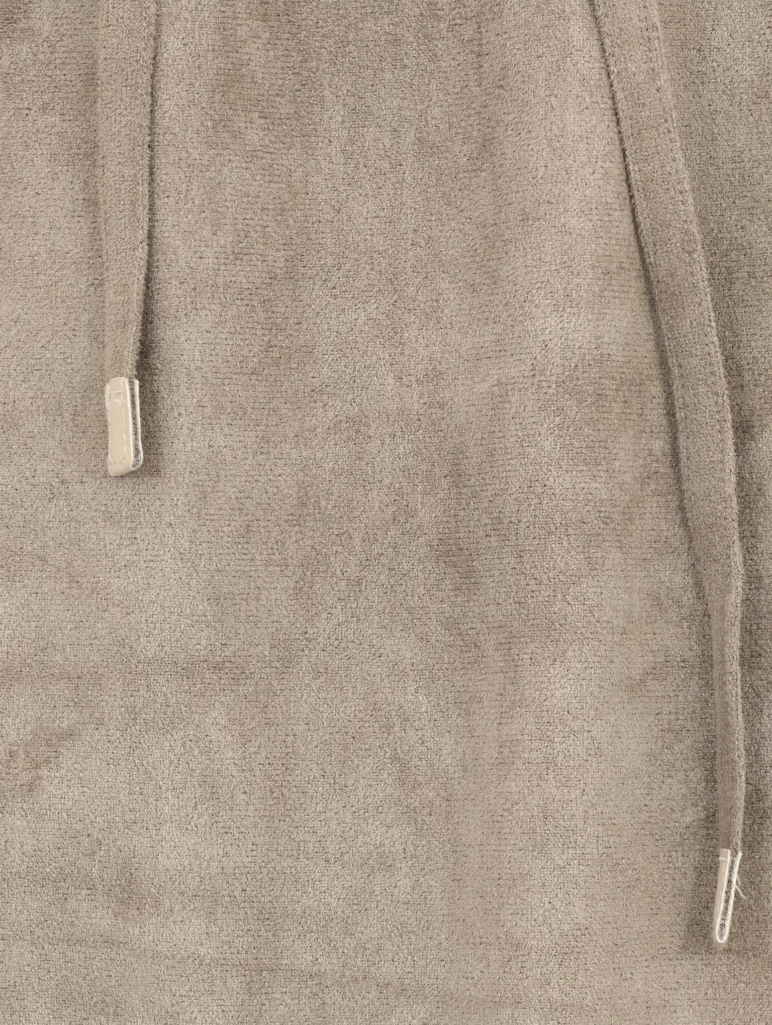 Tonal drawcord with metal tip on brushed fabric