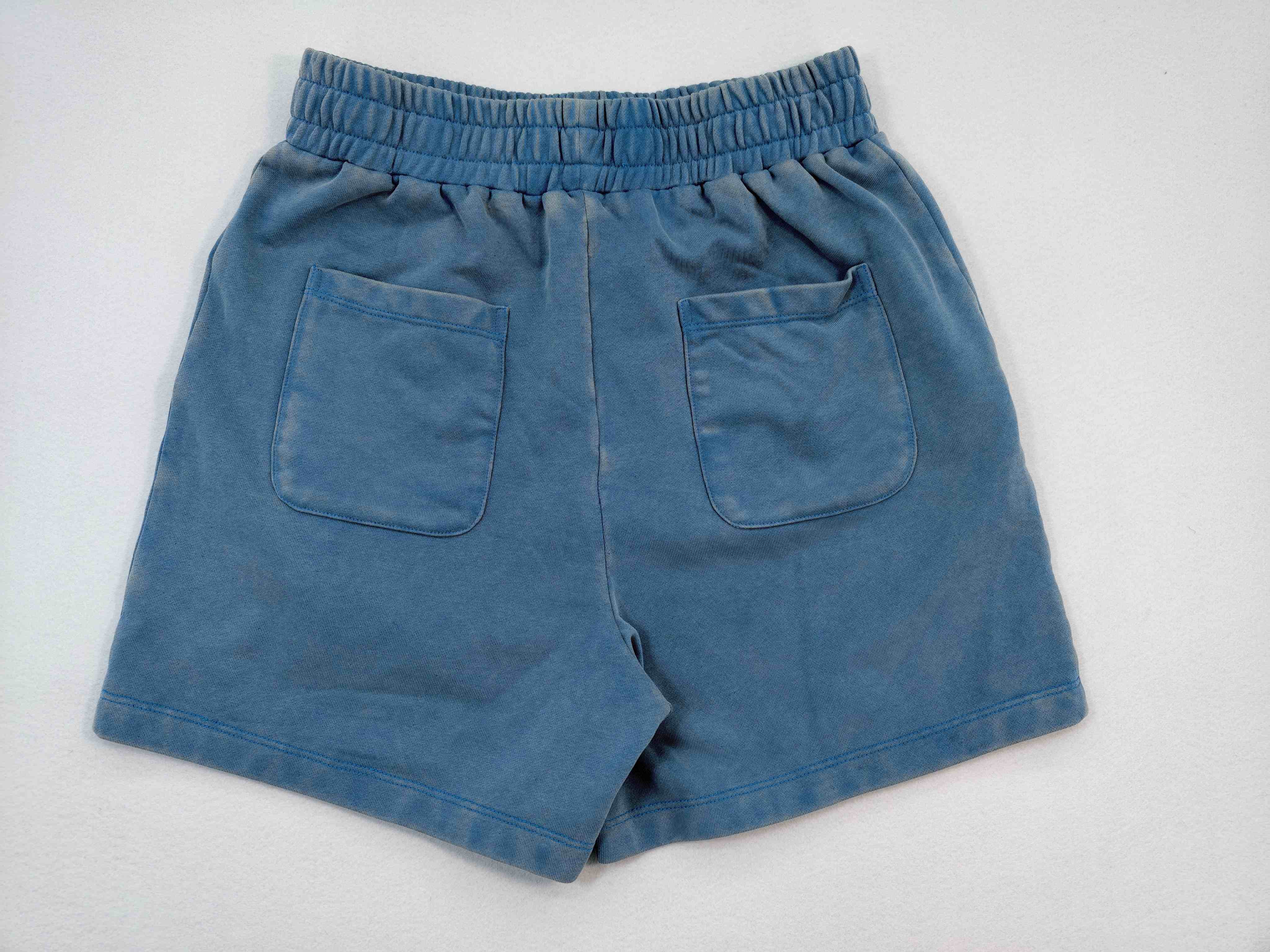 Back view with gathered waistband and twin patch pockets