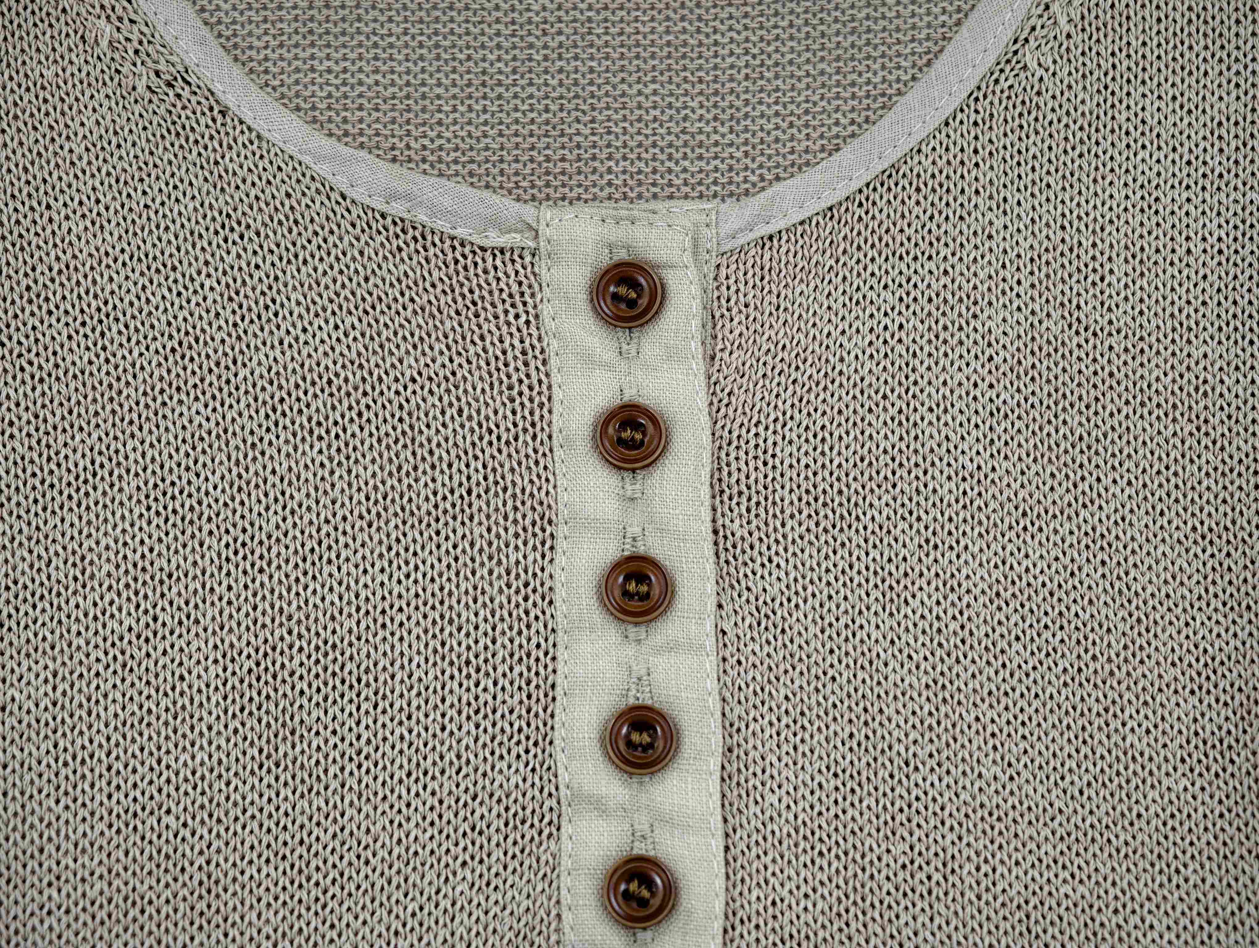 Scoop neckline, linen binding and five-button placket from a women’s knit top manufacturer