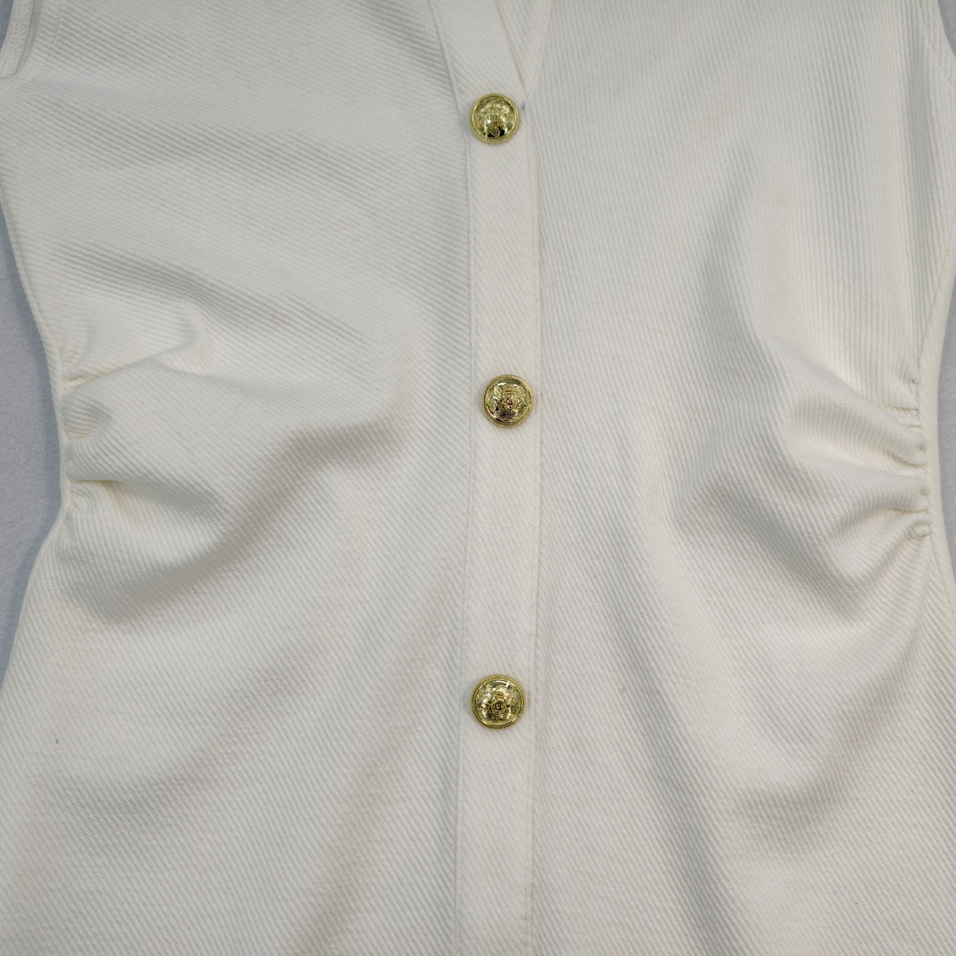 Gold button placket on 290 GSM cotton knit