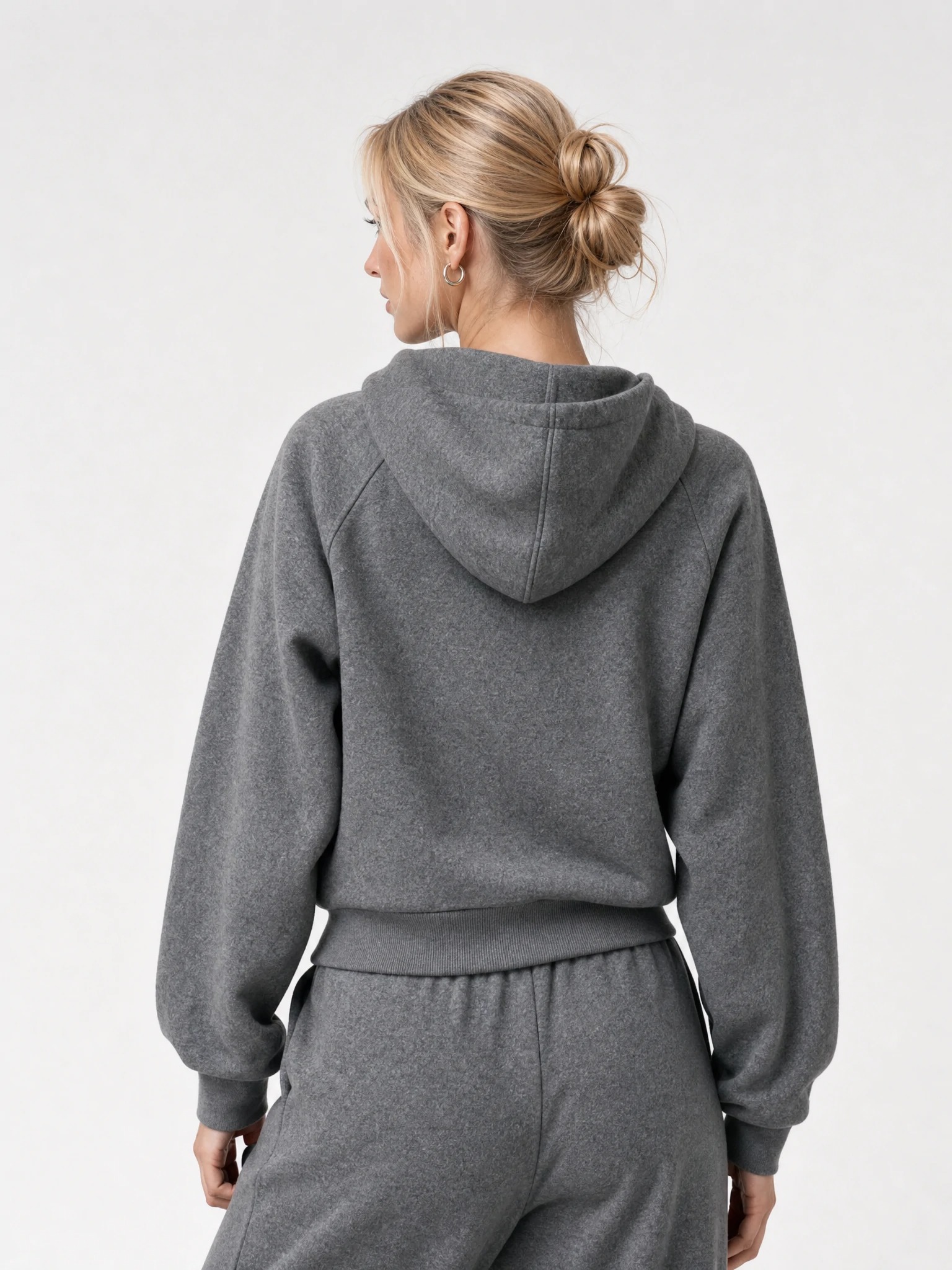 Back view of raglan-sleeve hoodie with structured hood