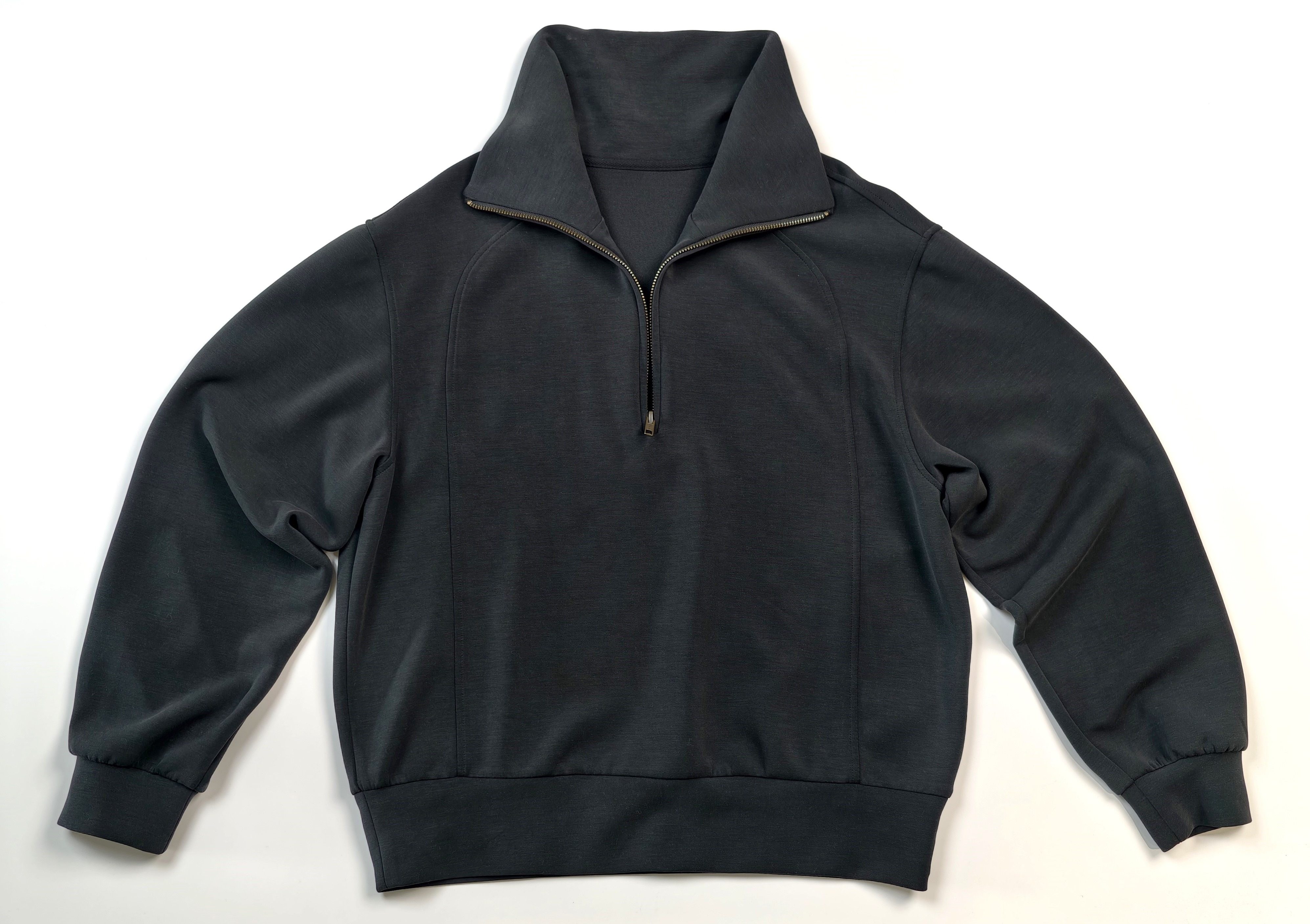 Flat front view with raised collar and ribbed hem