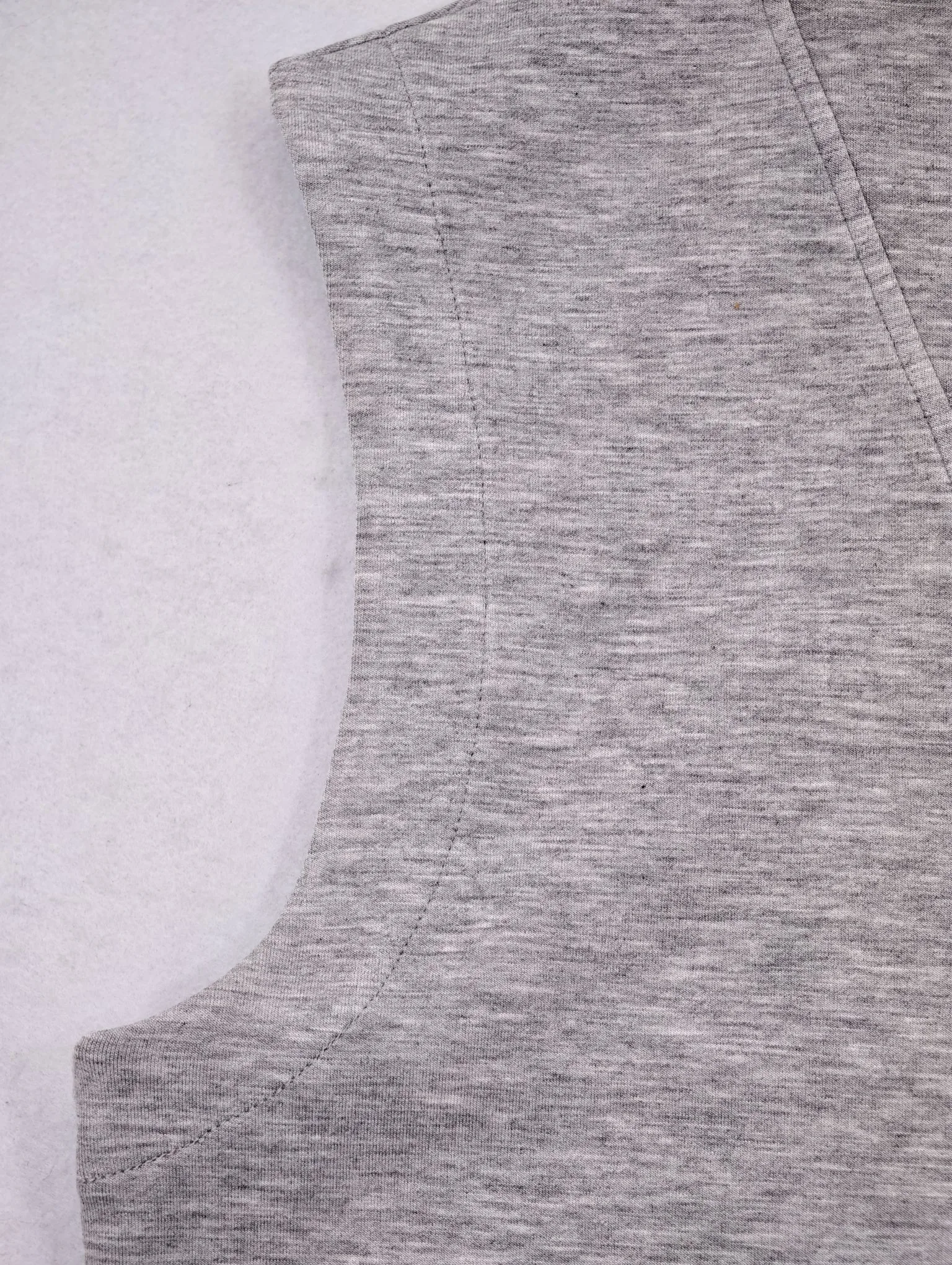 Extended shoulder and clean armhole construction detail