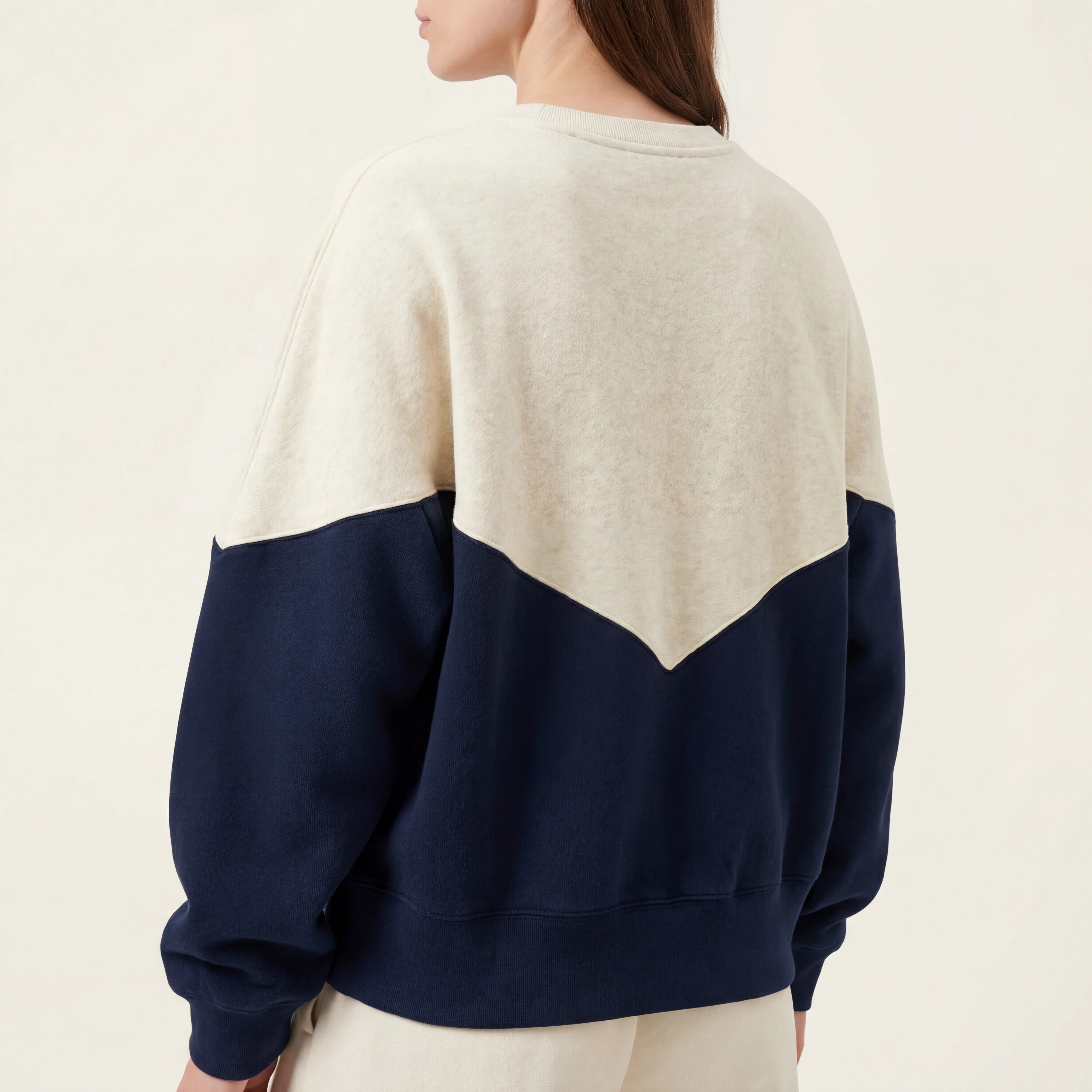 Back view showing chevron panel and ribbed hem