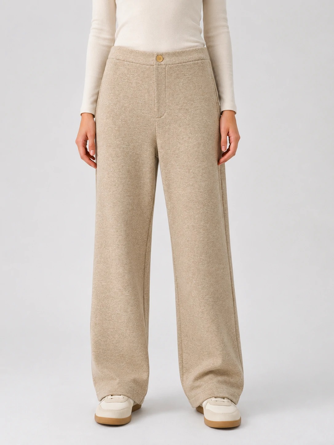 Women wearing oatmeal textured wide-leg tailored pants