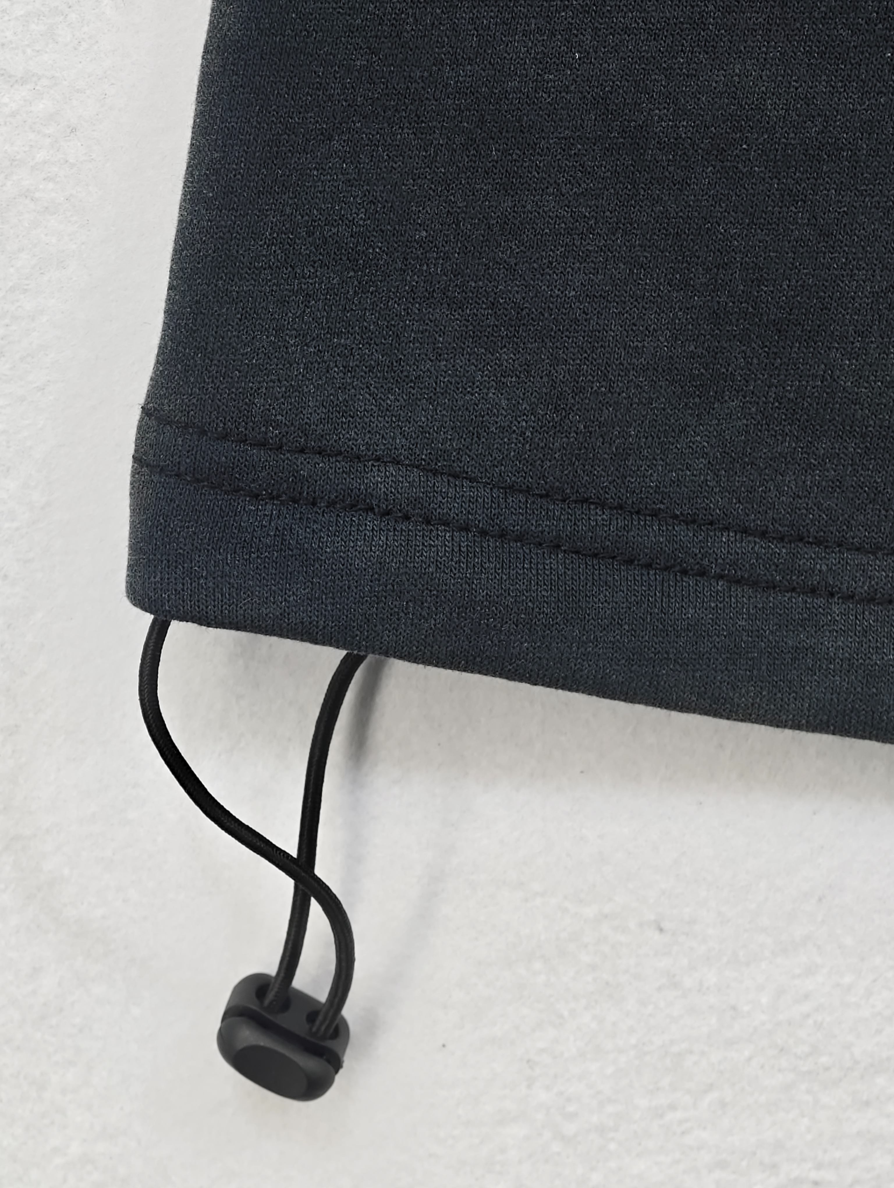 Adjustable bungee hem with black cord toggle