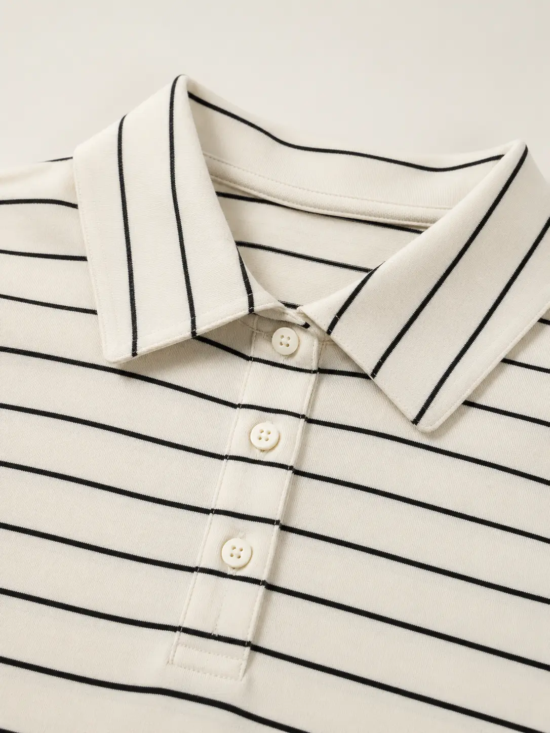 Point collar and button placket construction close-up