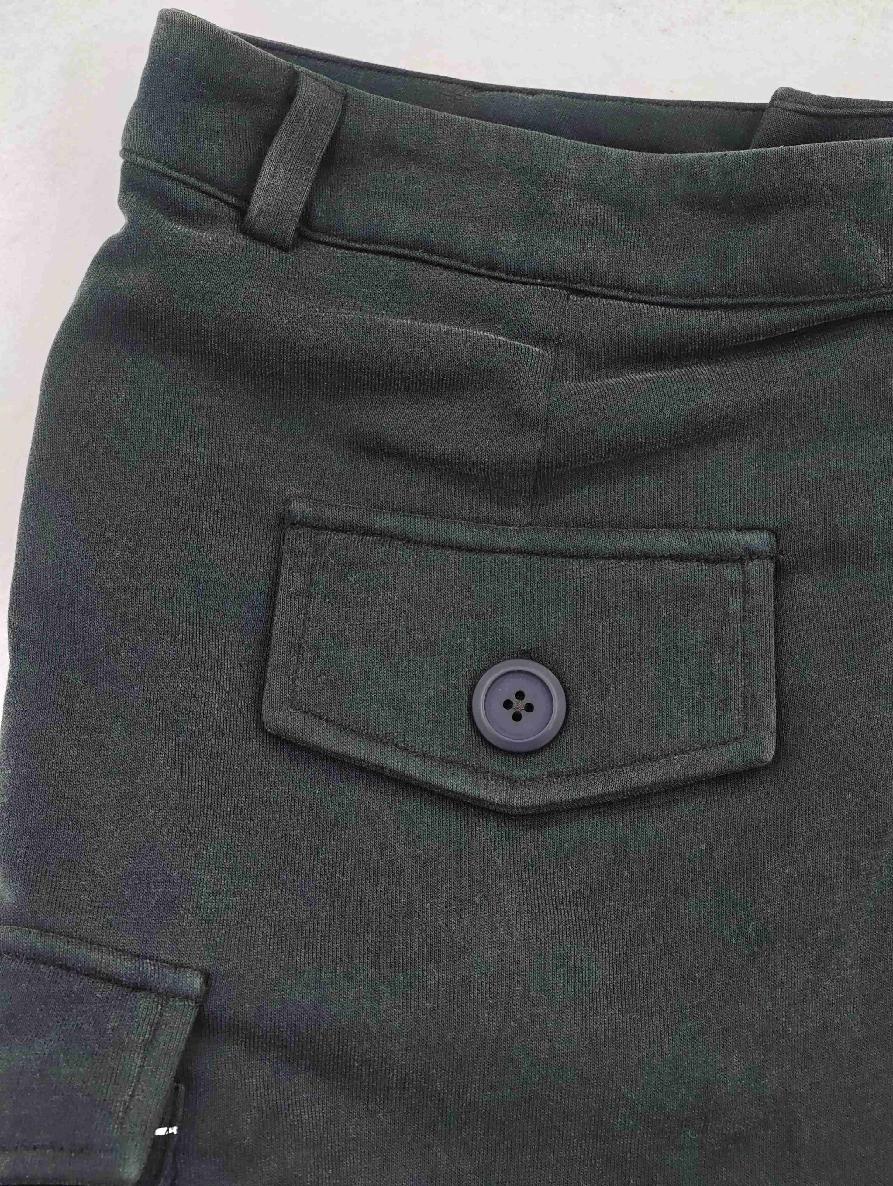 High-rise waistband with buttoned flap pocket detail