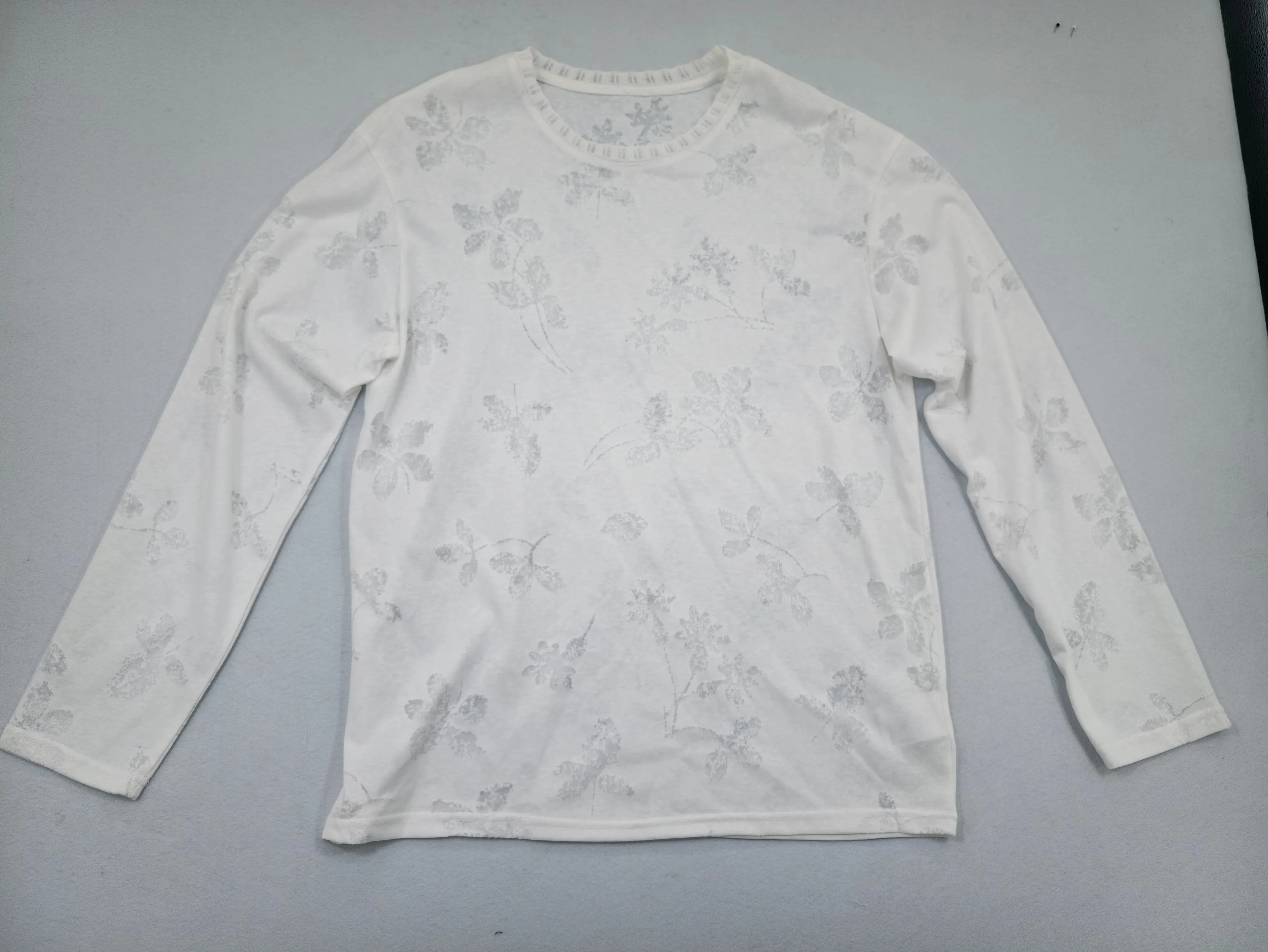 Ivory floral burnout jersey top shown from front